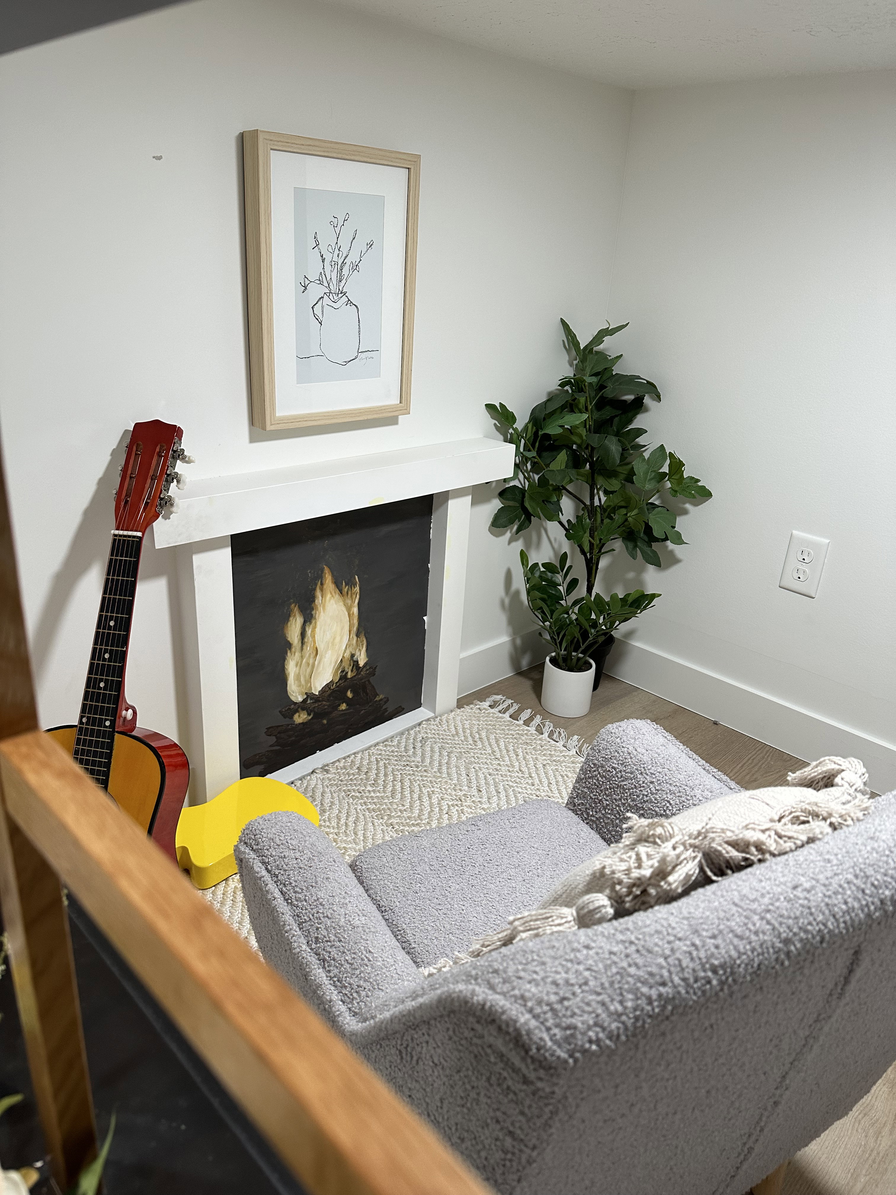 2 story play house/living room with faux fireplace