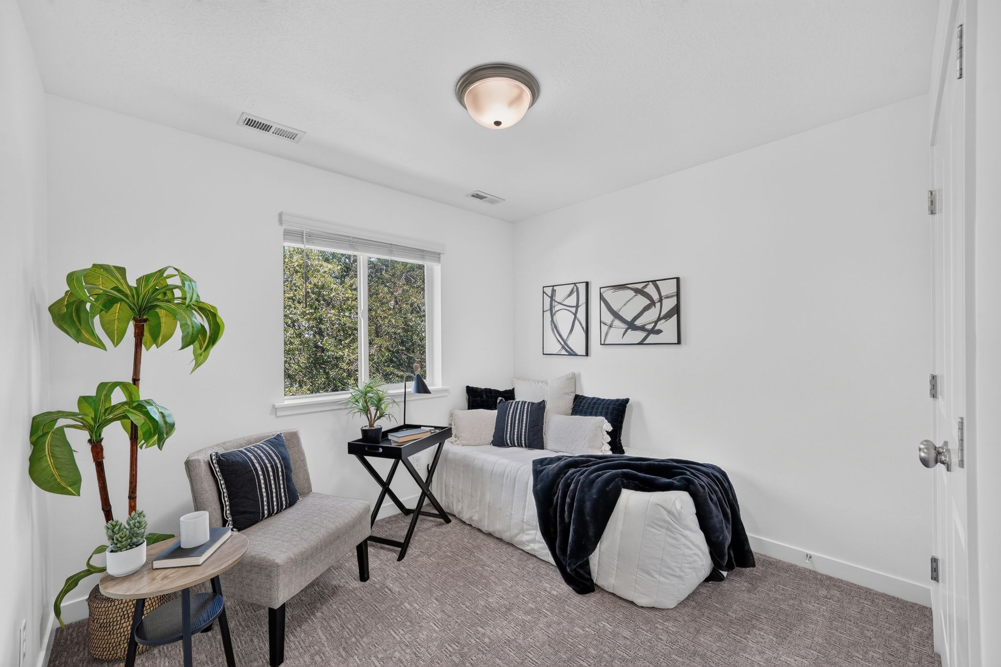 Neutral wall finishes, recessed lighting, and a window with blinds