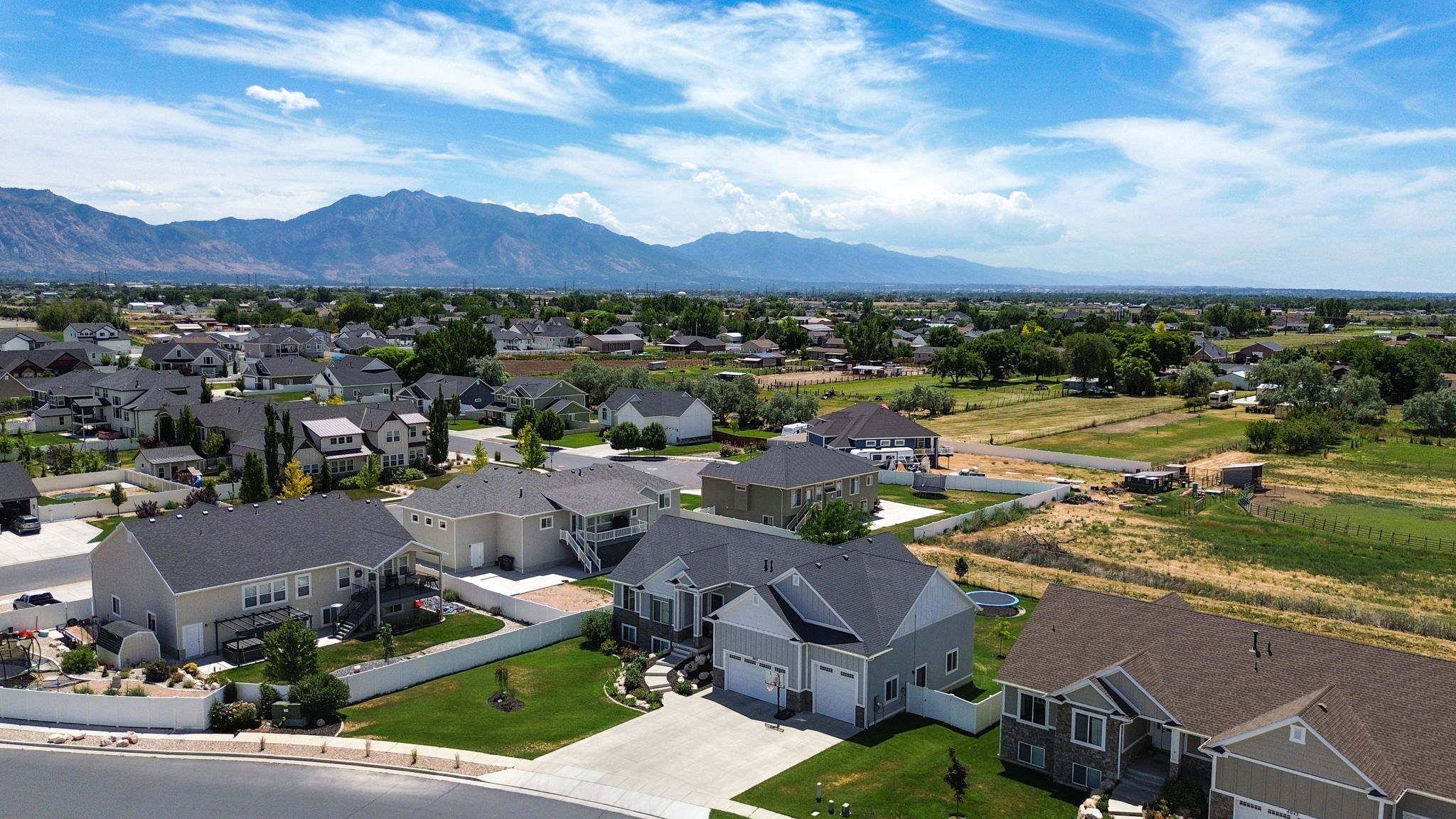Expansive residential neighborhood with distant mountain ranges