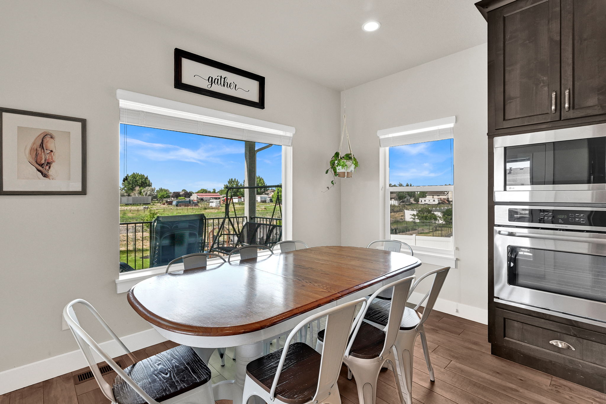 Dining area featuring a wood-finish dining table and white base