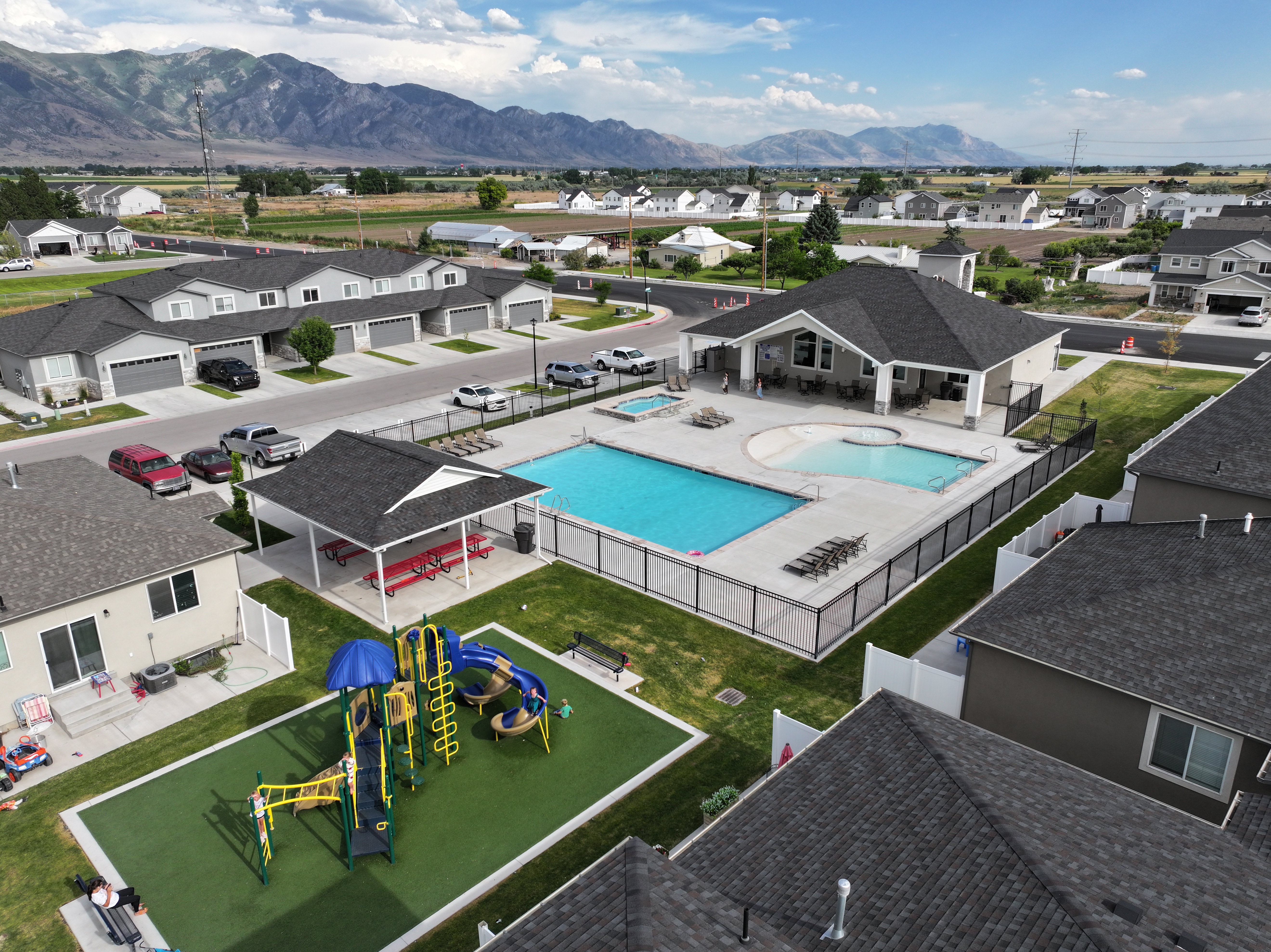 Community amenities featuring a playground, a swimming pool, separate spa, and dedicated clubhouse