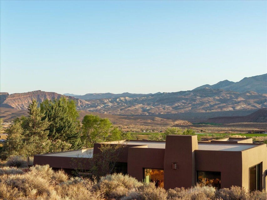 Southwestern-style architecture featuring a flat roofline and stucco exterior