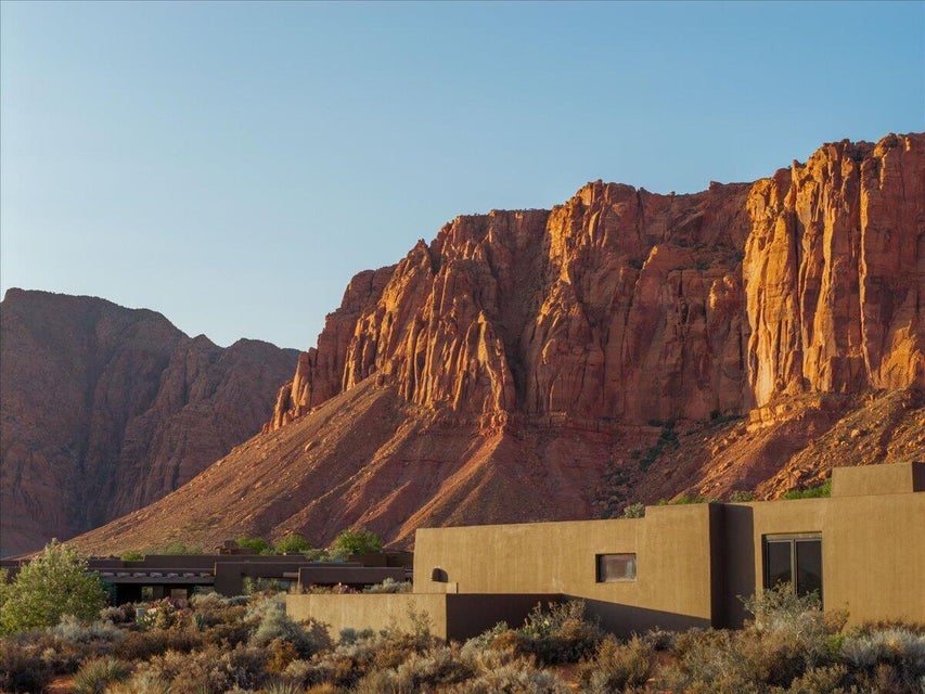 Southwestern-style architecture featuring a stucco exterior and flat roofline