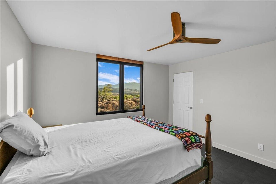 Room with dark-finish flooring and light gray walls