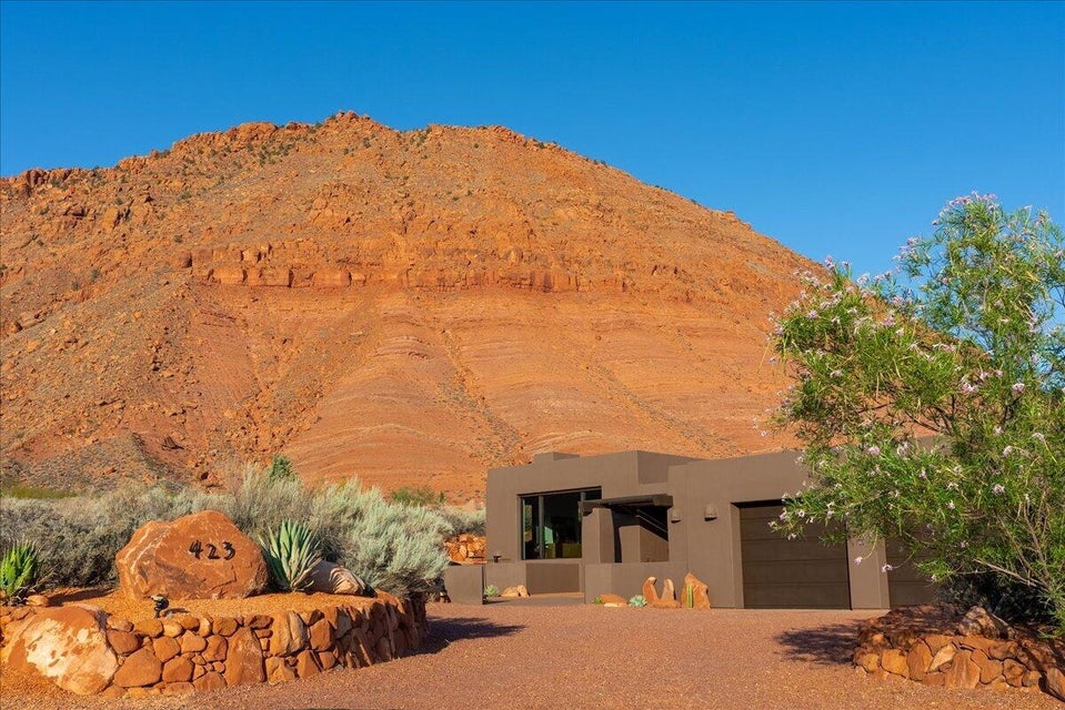 Contemporary stucco exterior with an integrated garage