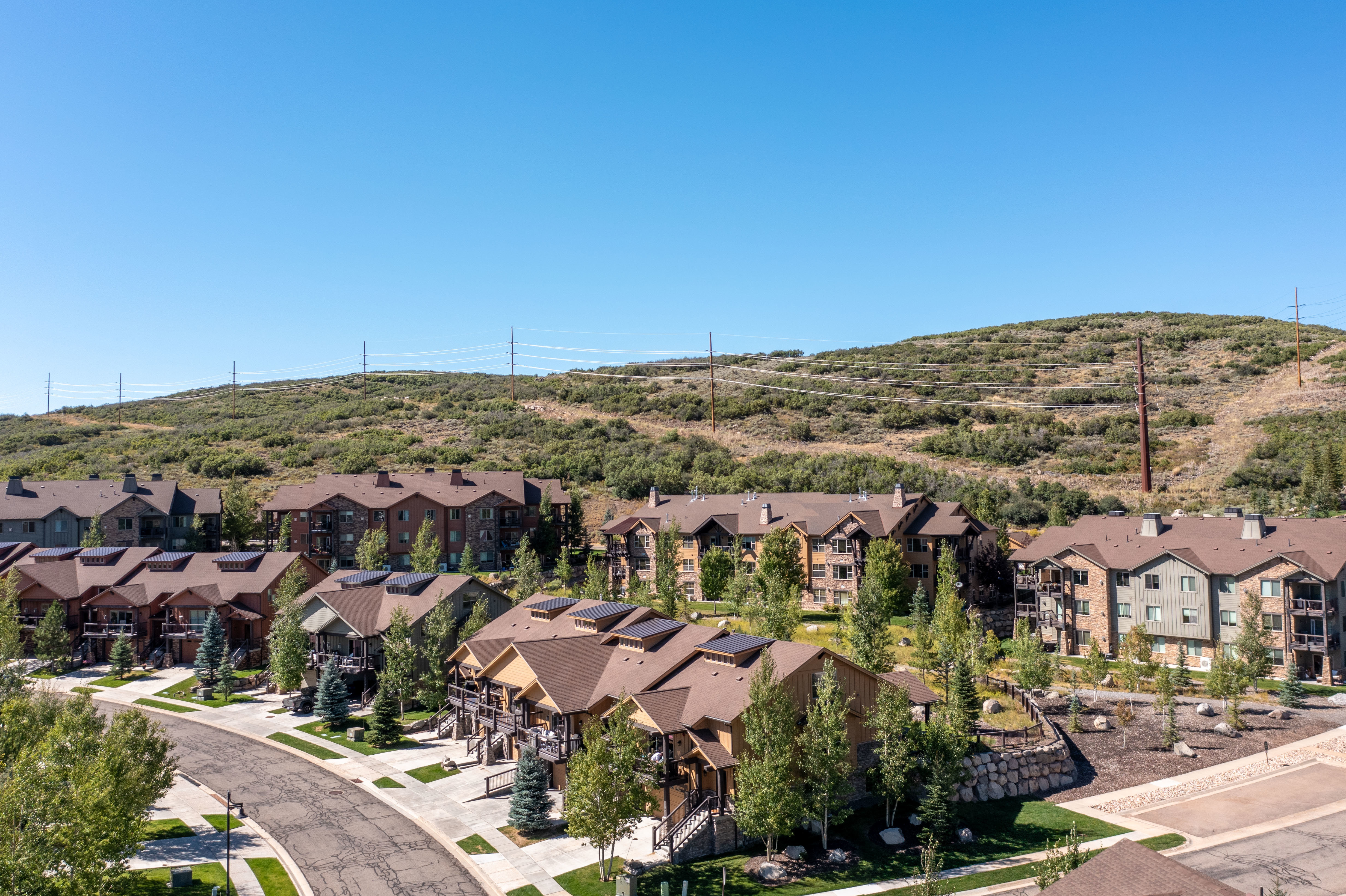 Residential development featuring multiple buildings with gabled roofs and individual balconies