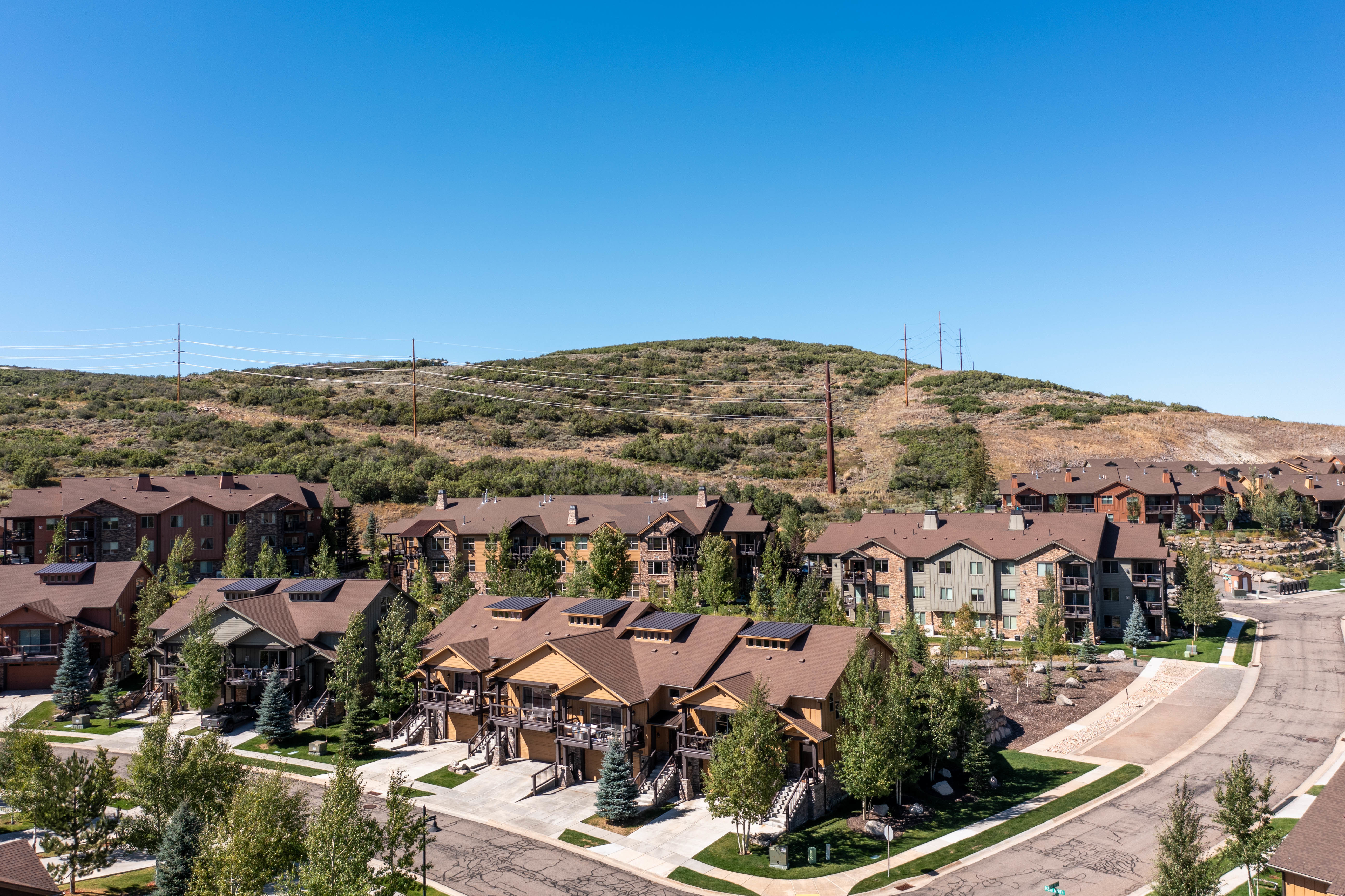 Residential community featuring multi-story properties with varied exterior finishes