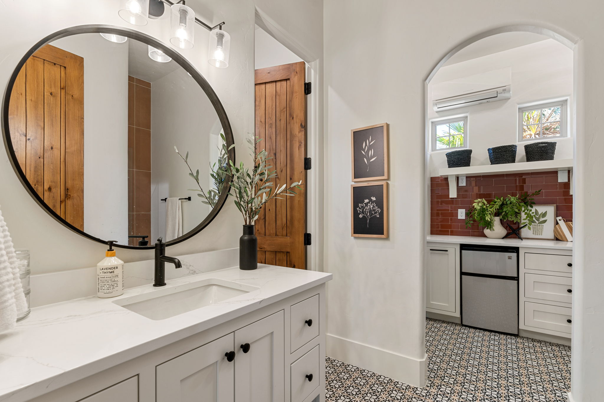 Vanity featuring a rectangular undermount sink, quartz-finish countertop, and matte black faucet