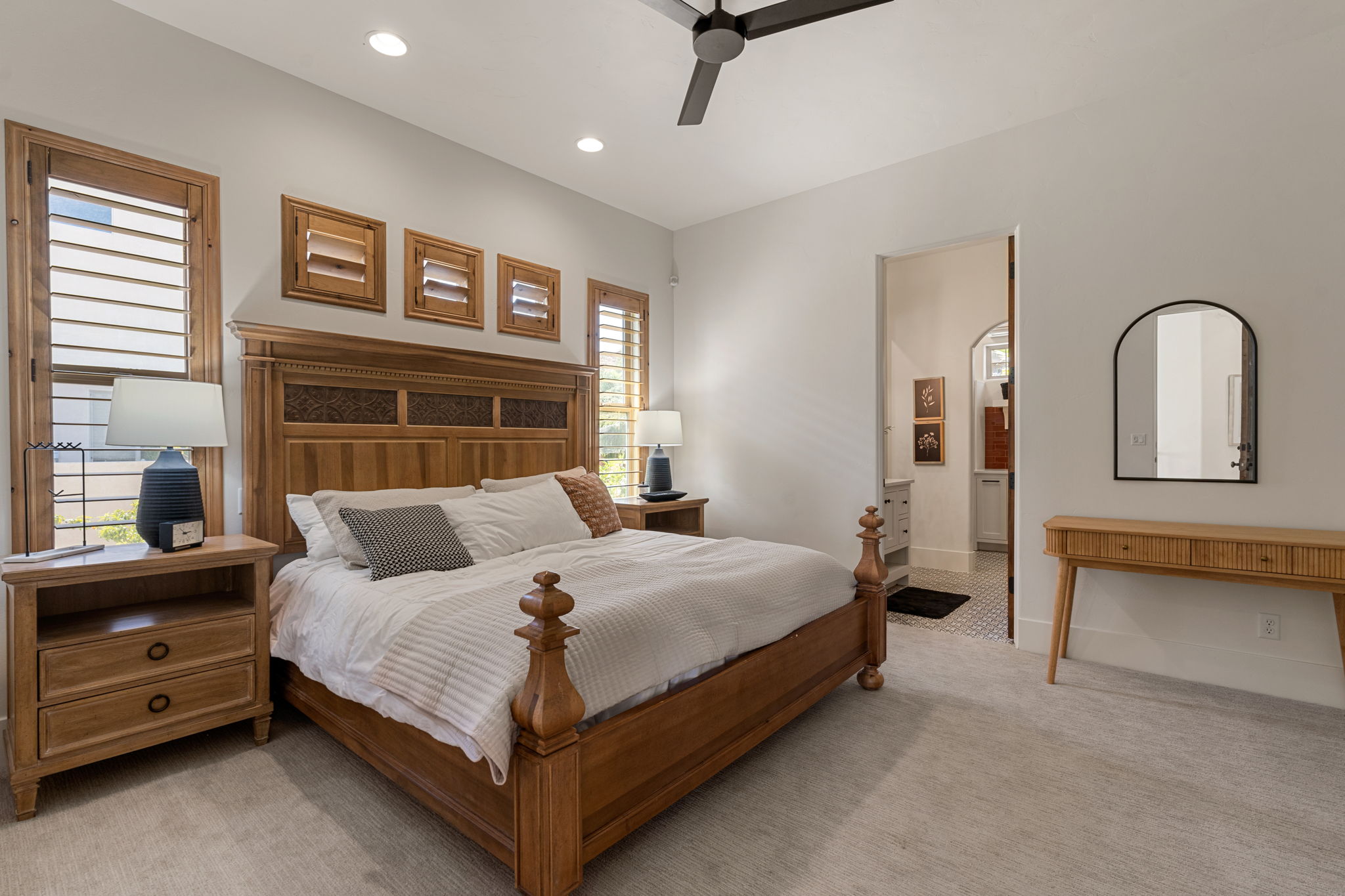 Spacious room with light-toned wall paint and carpet flooring