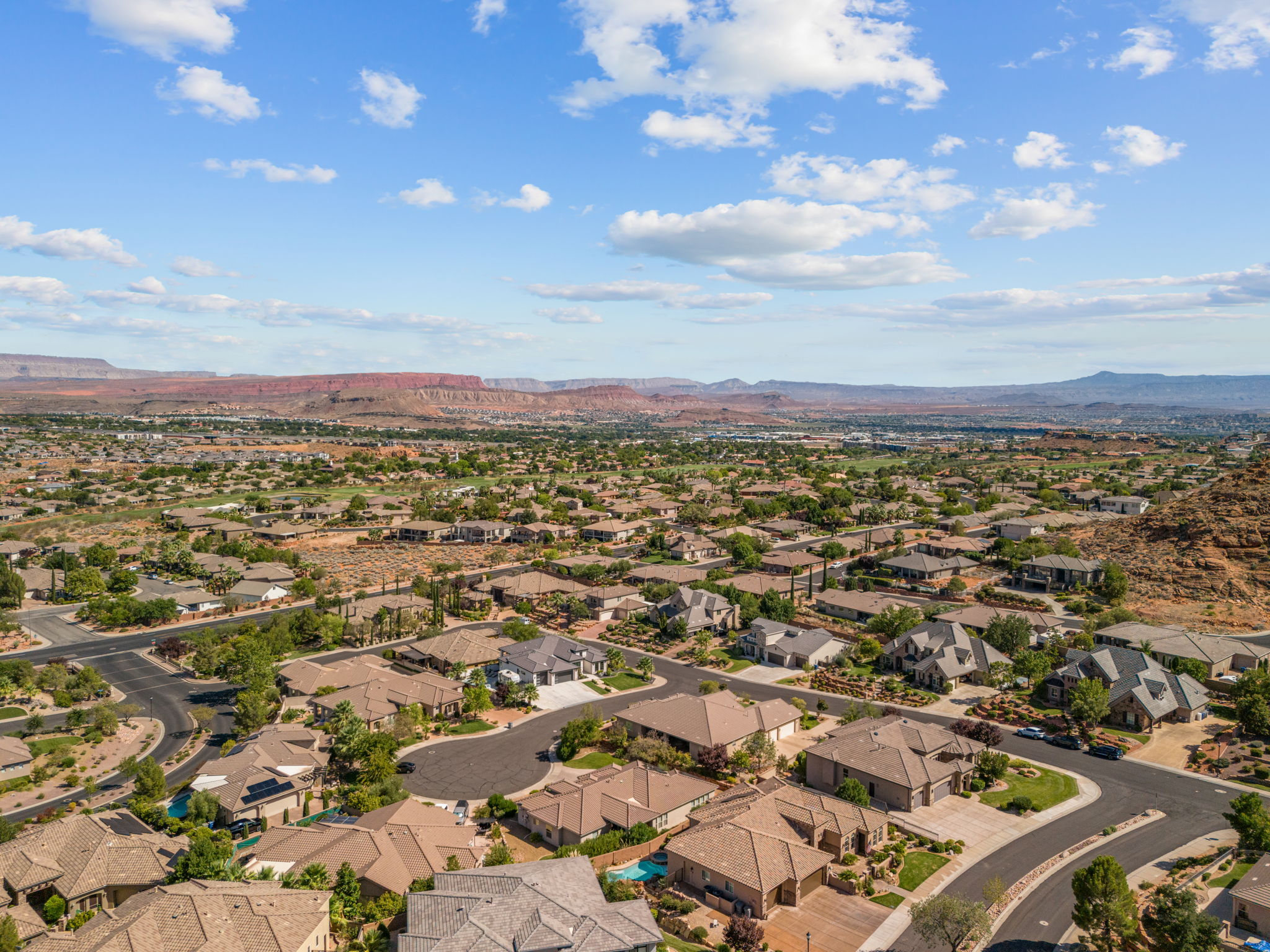 Expansive residential neighborhood featuring varied architectural styles and mature desert landscaping