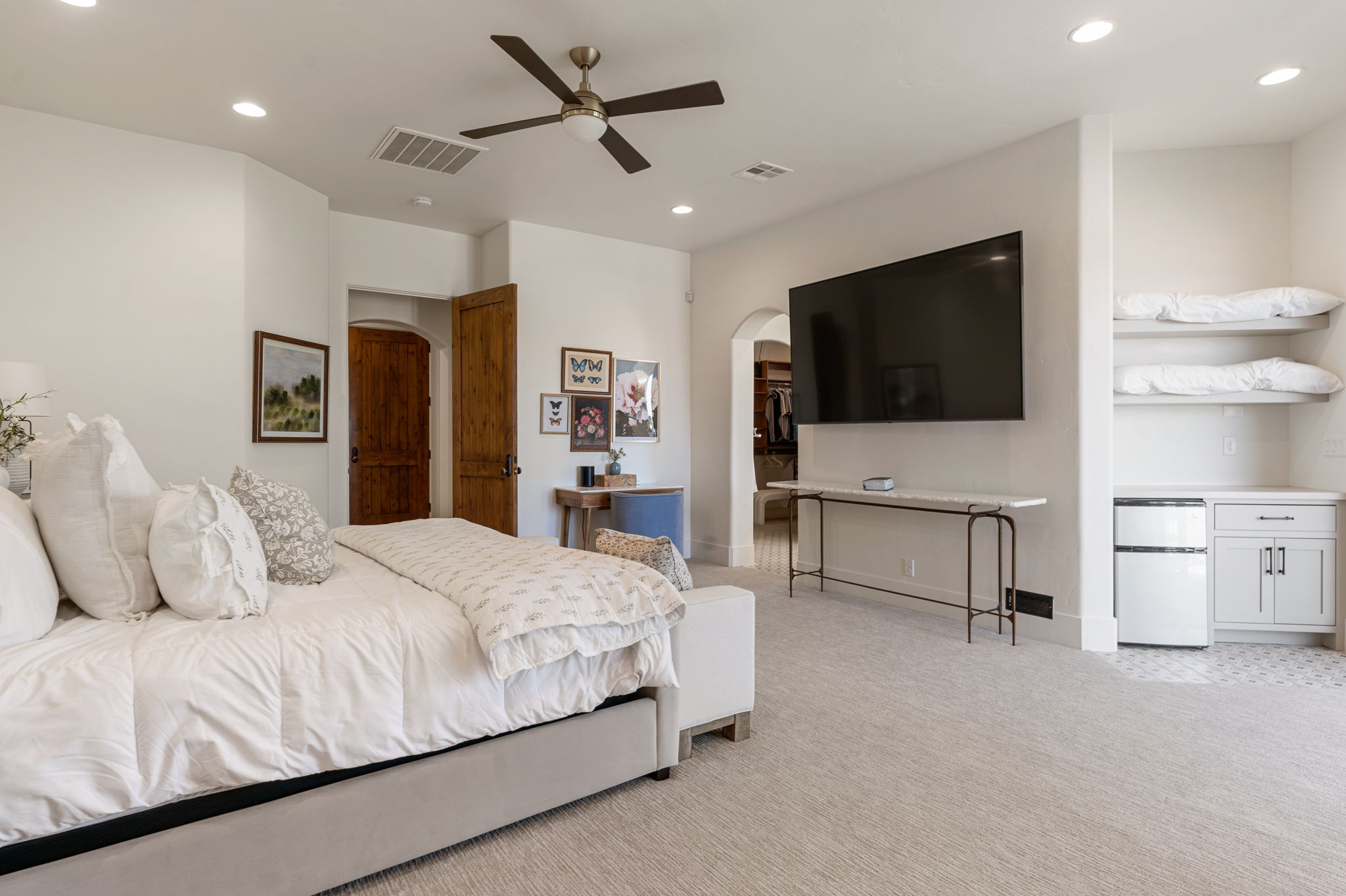 Spacious bedroom featuring recessed lighting and a ceiling fan
