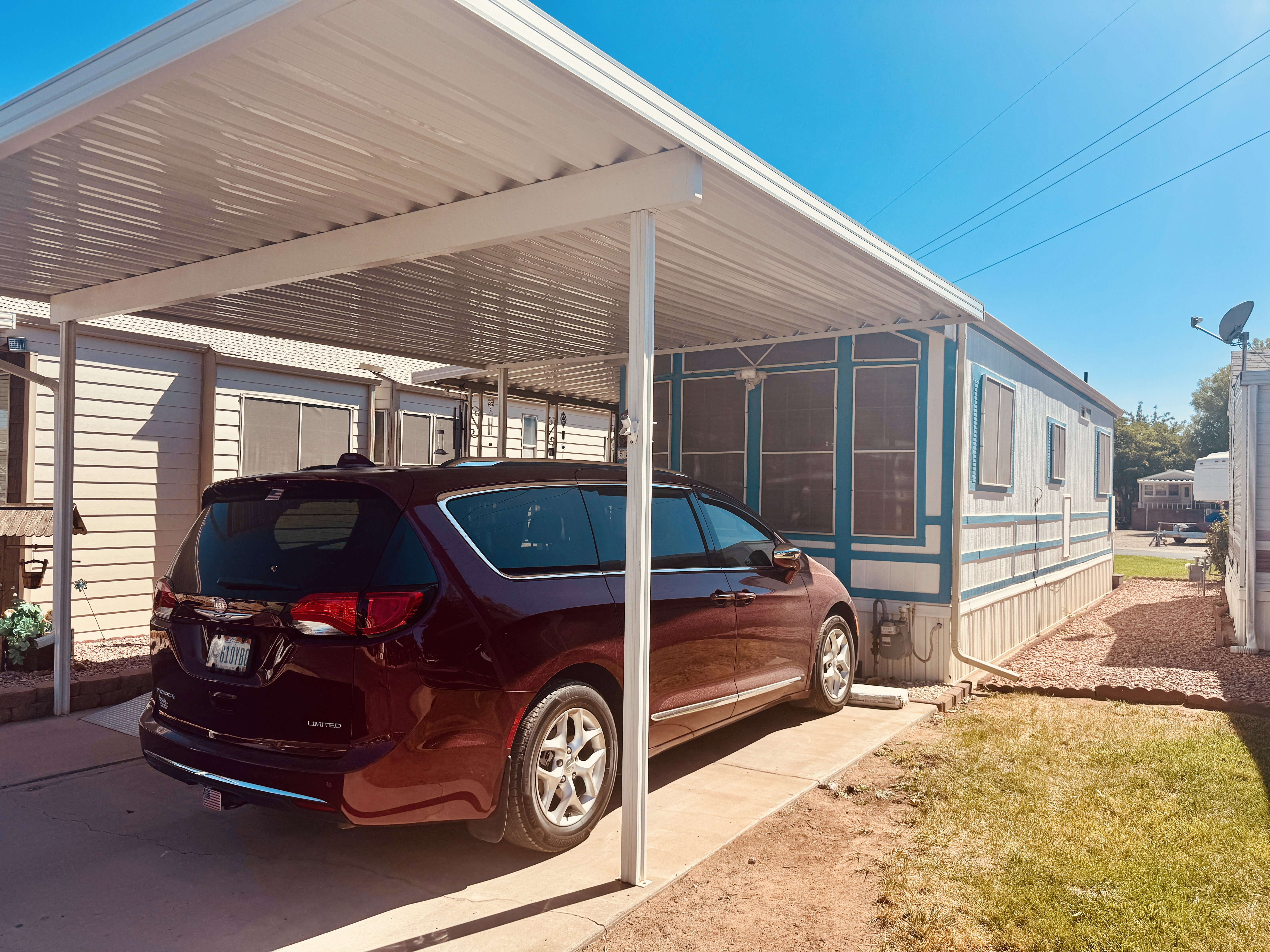 Carport structure providing sheltered parking