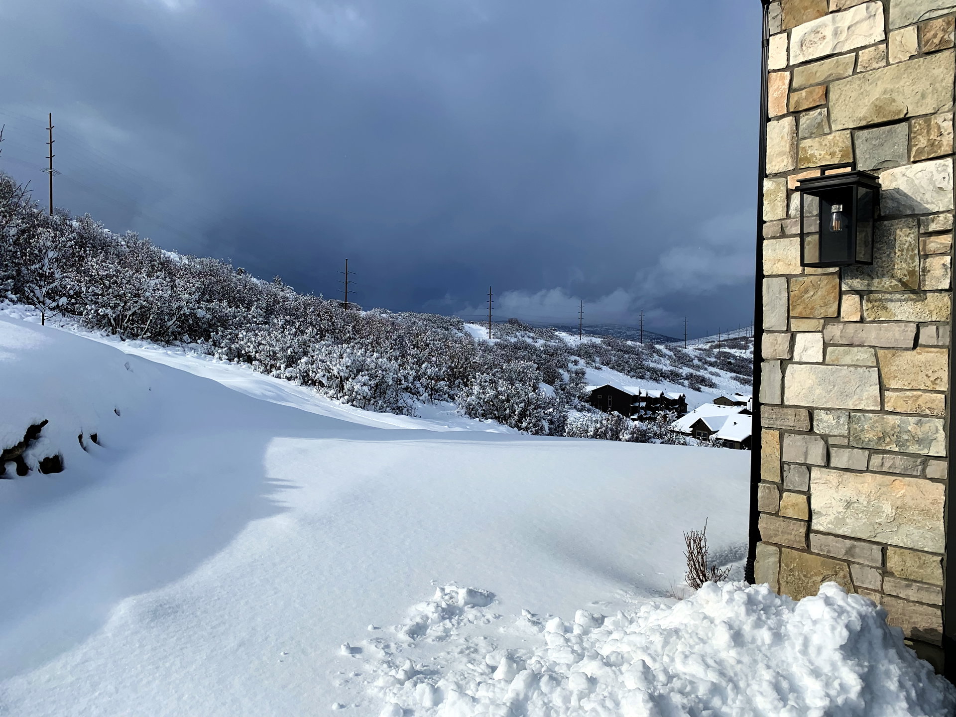 Stone exterior wall with an attached outdoor lantern