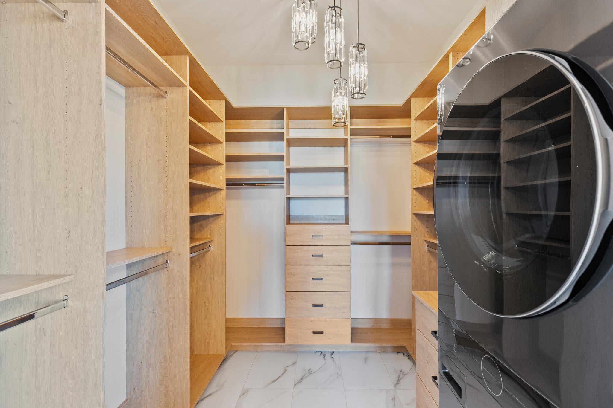 Custom closet system with integrated shelving and drawer storage