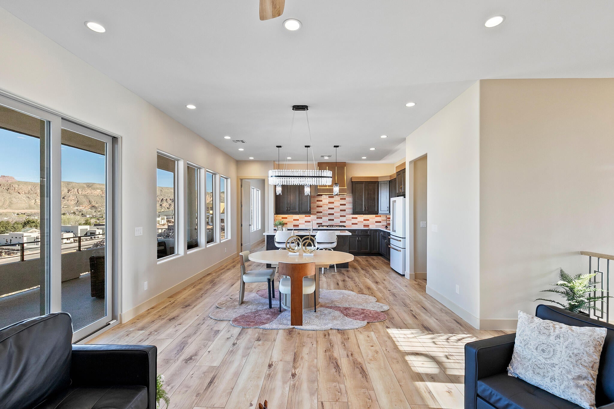 Open-concept living space with blonde wood-finish flooring