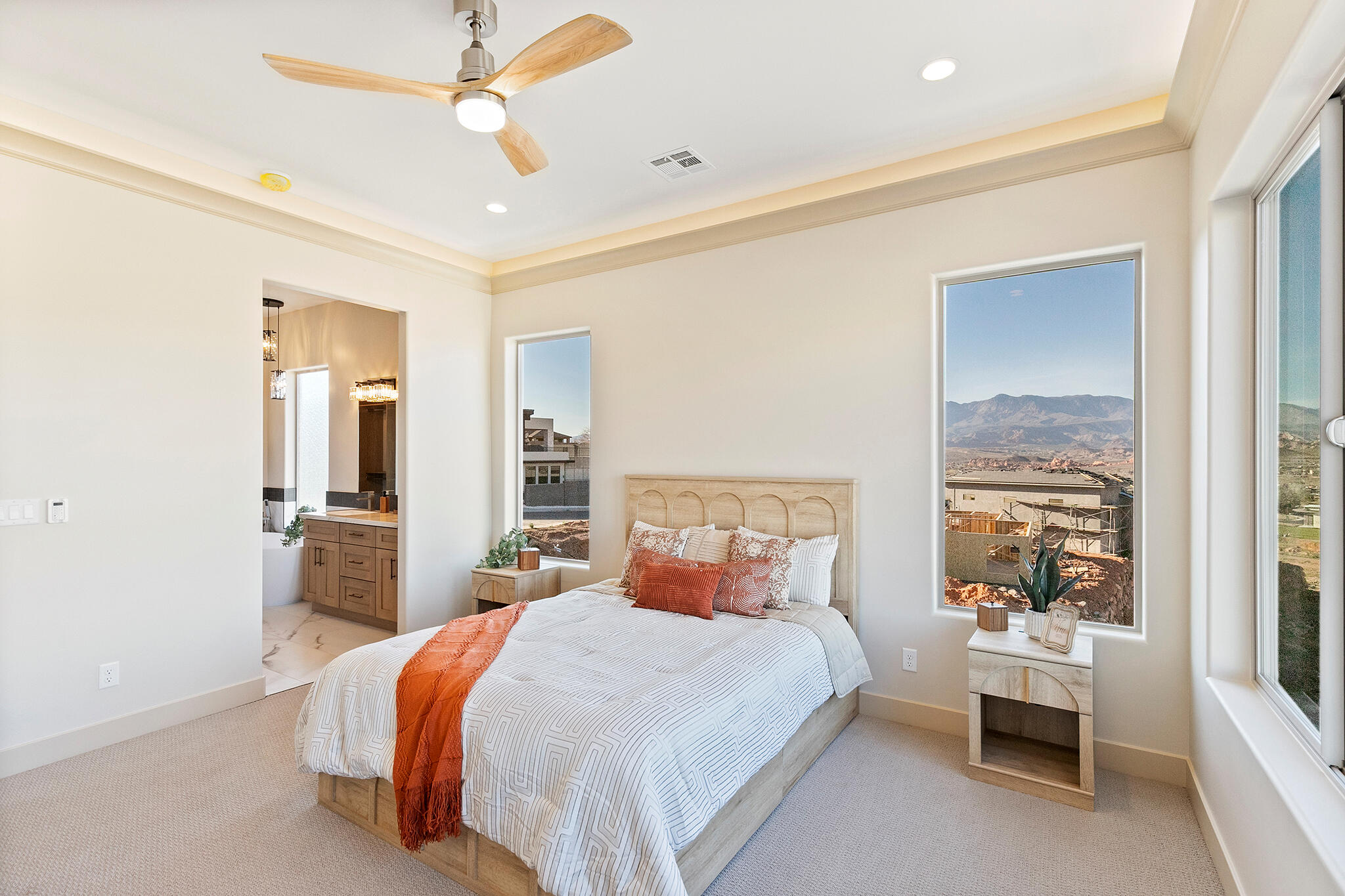 Well-appointed bedroom featuring a ceiling fan with integrated lighting, recessed ceiling lighting, and crown molding