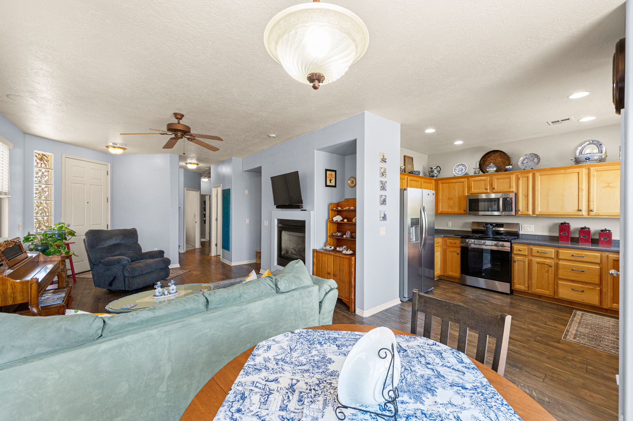 Open-concept living area featuring wood-finish flooring throughout