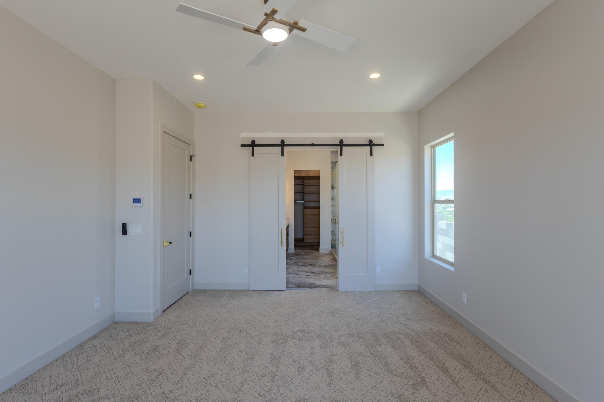 Room featuring a ceiling fan with integrated lighting, recessed lighting, and a window providing natural illumination