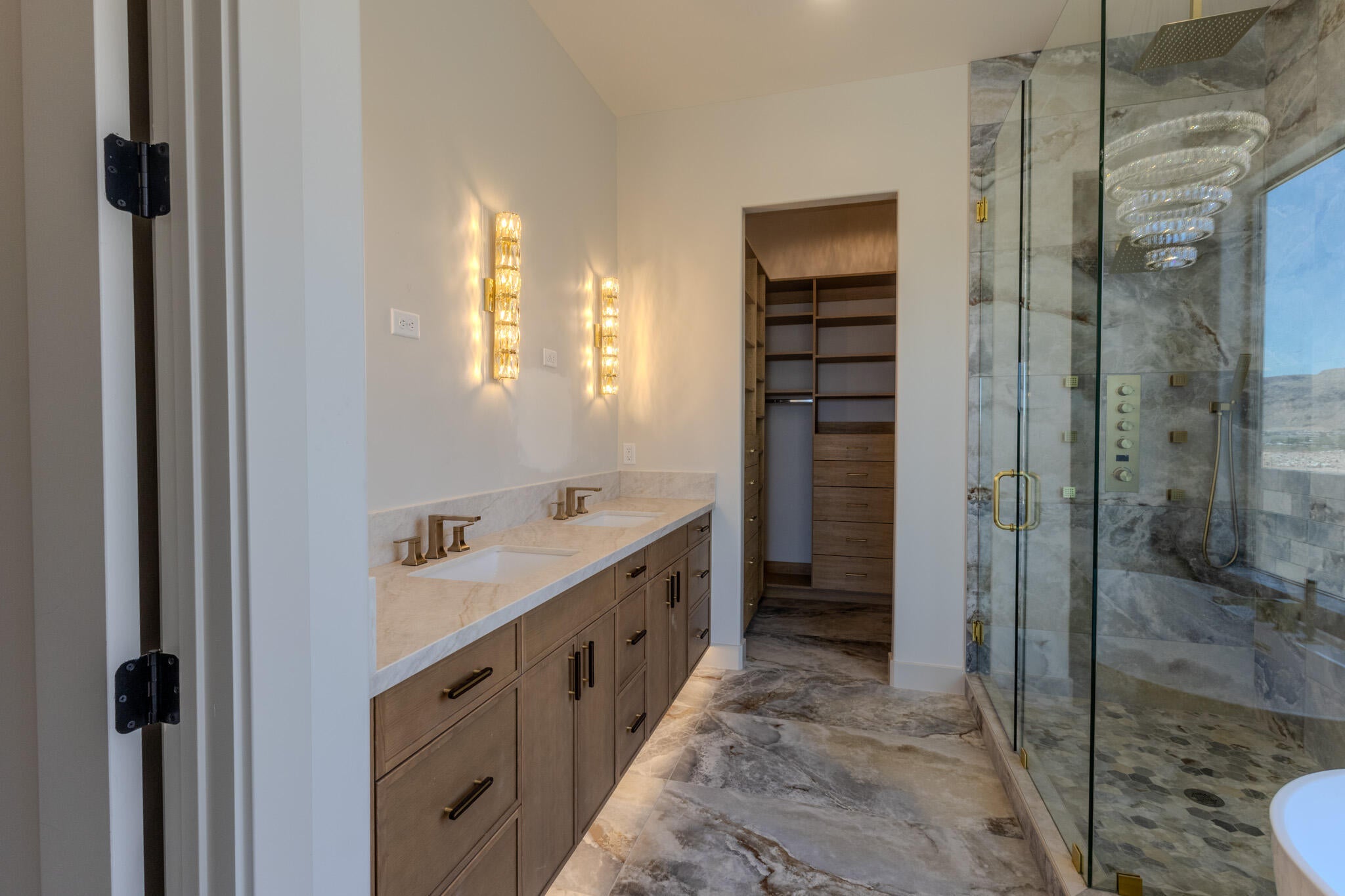 Dual vanity with stone countertops and undermount sinks