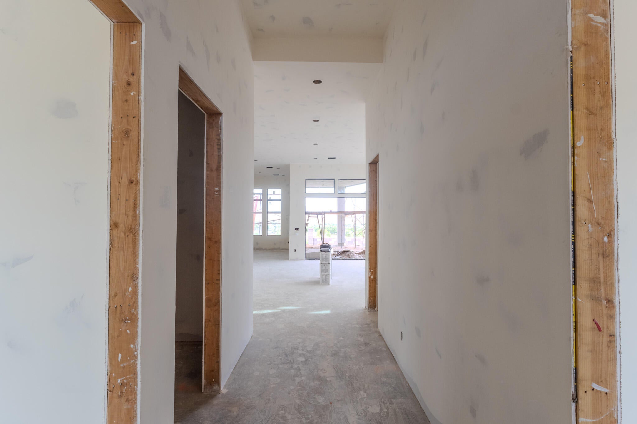 Open concept interior framing a spacious room with multiple large windows