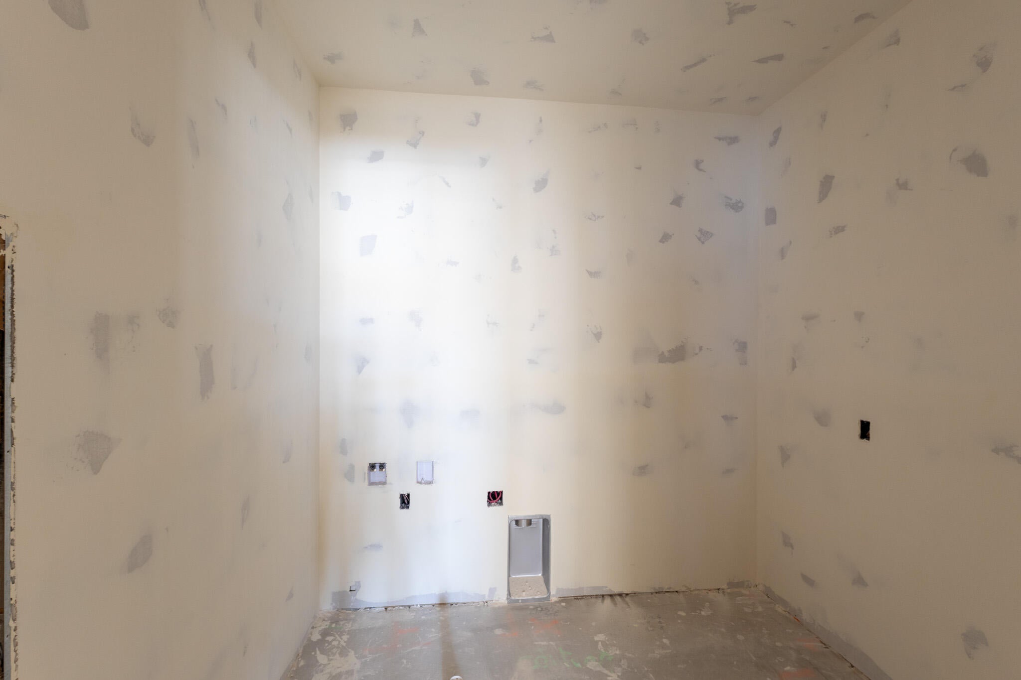 Utility connections featuring water hookups and electrical outlets, ready for appliance installation