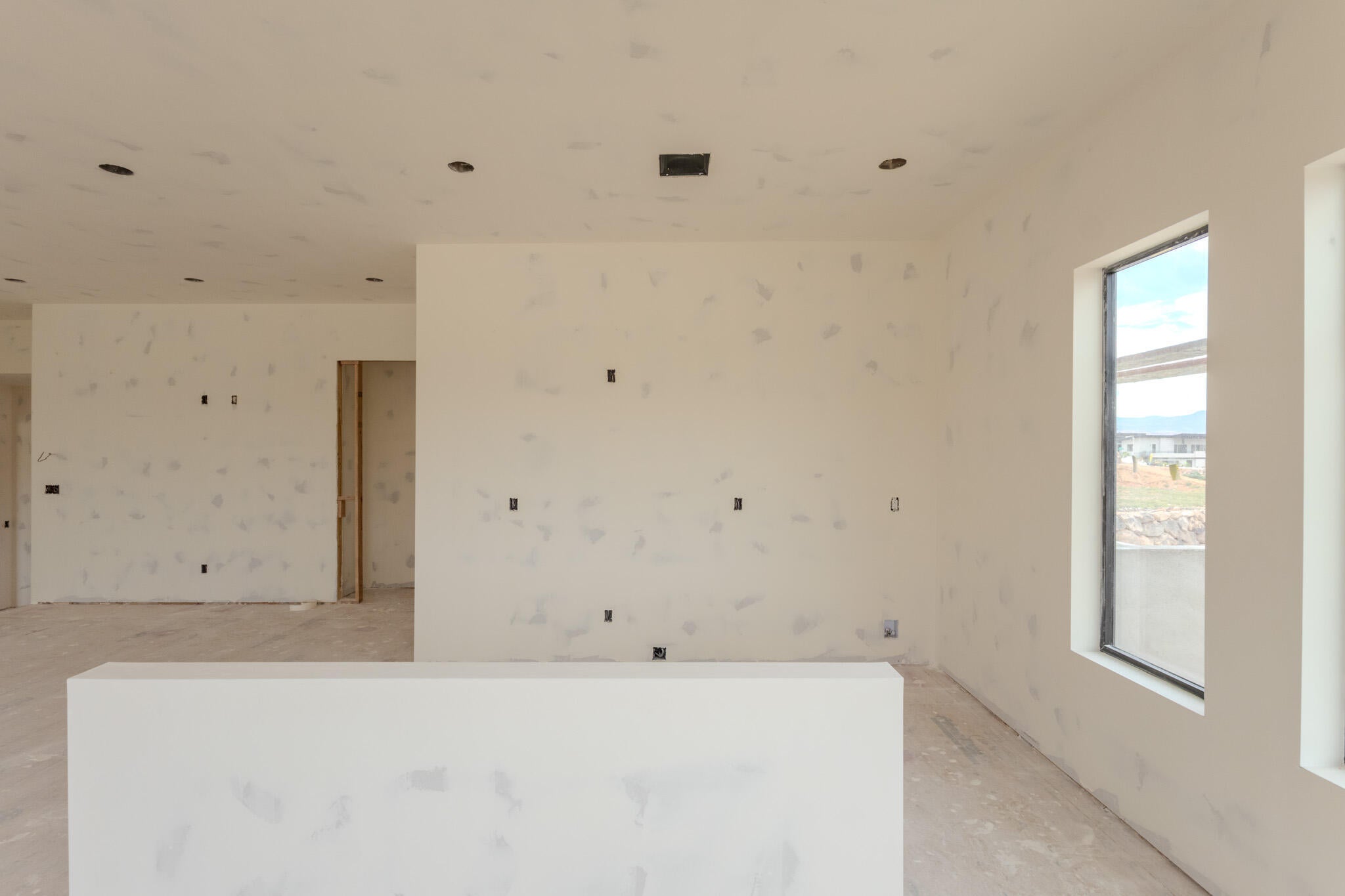 Open concept interior space featuring multiple windows