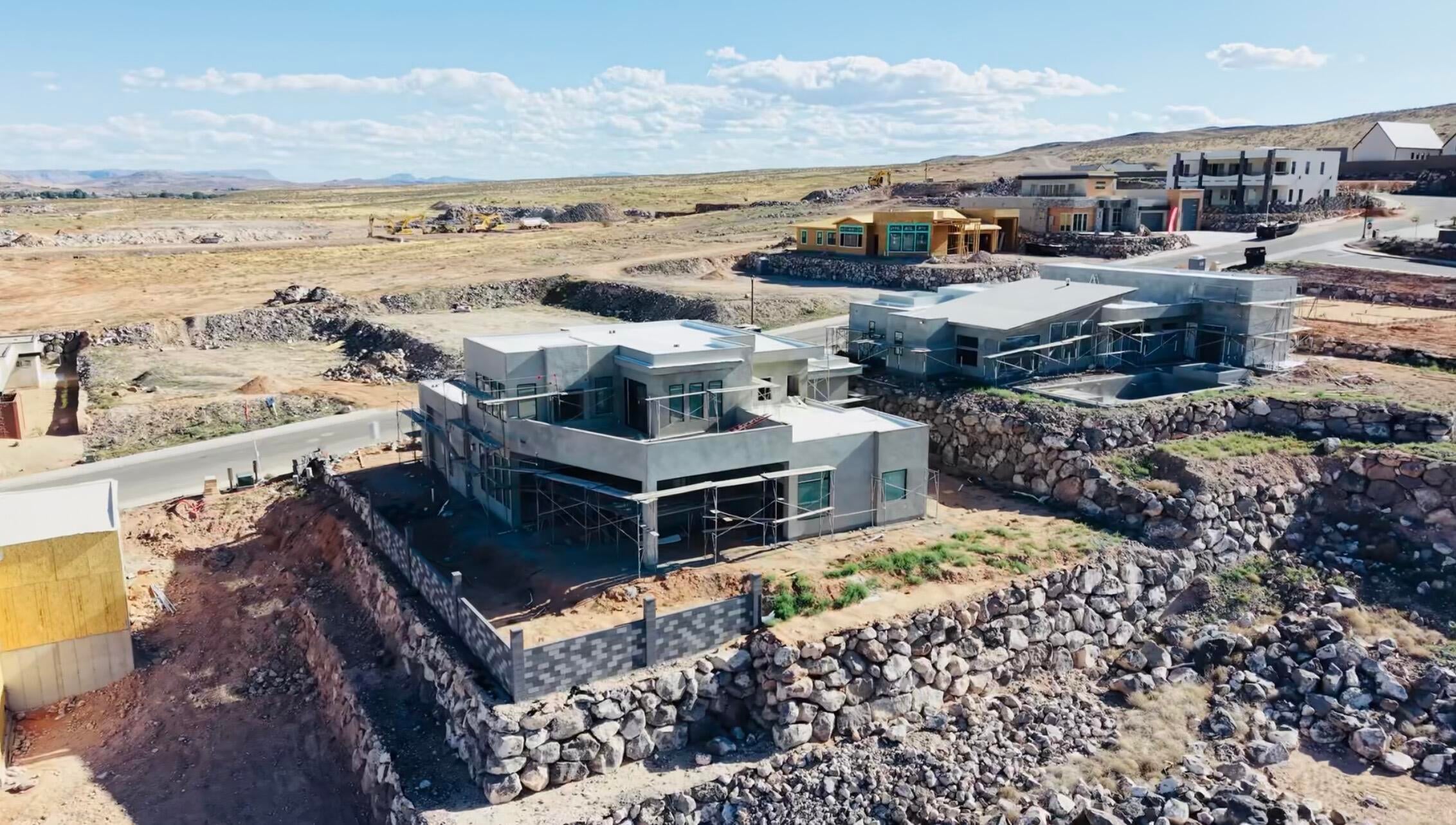 Contemporary new construction featuring multi-level design and a flat roofline