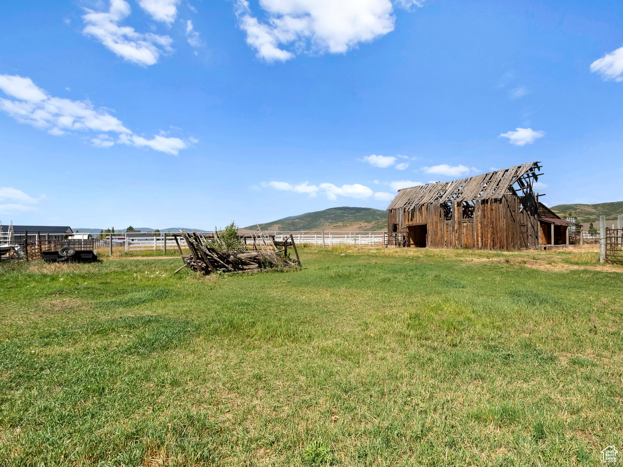 Large open area with rustic wood barn.