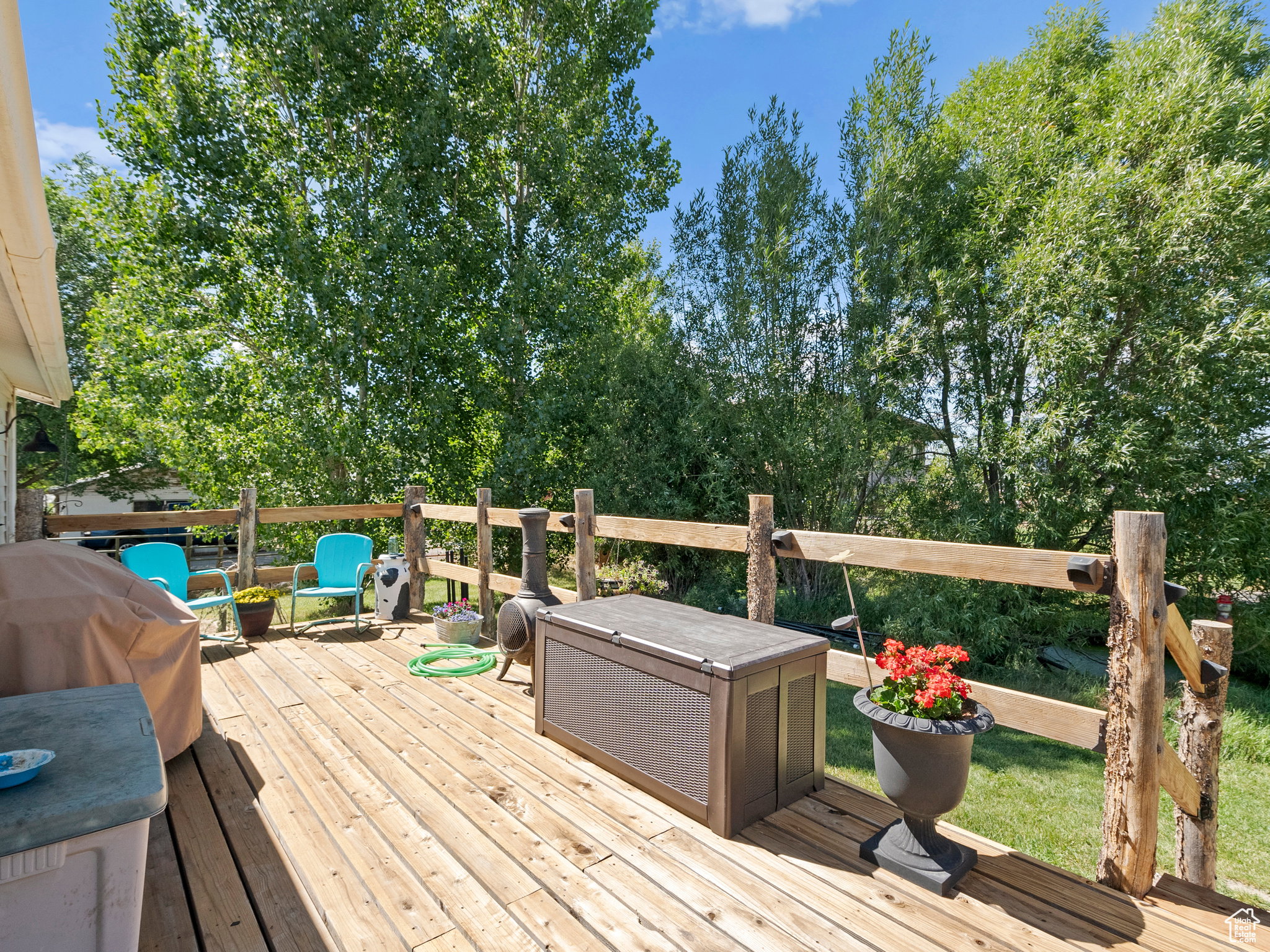 Back of the home, featuring a large wooden deck.