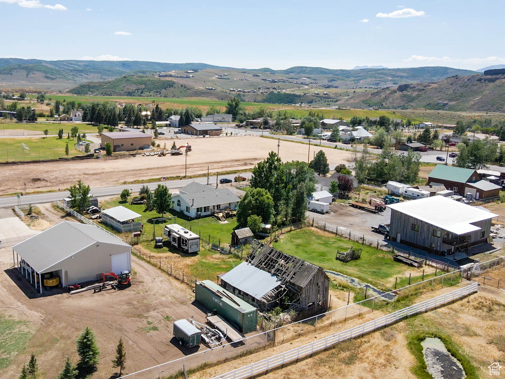 Aerial view of property, showing the year round spring that runs through.