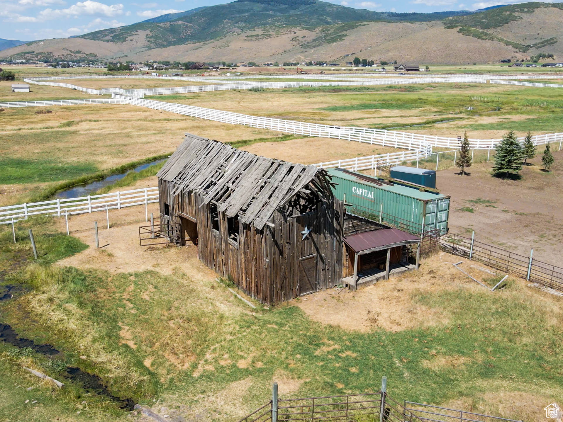 Open area with rustic wood barn.