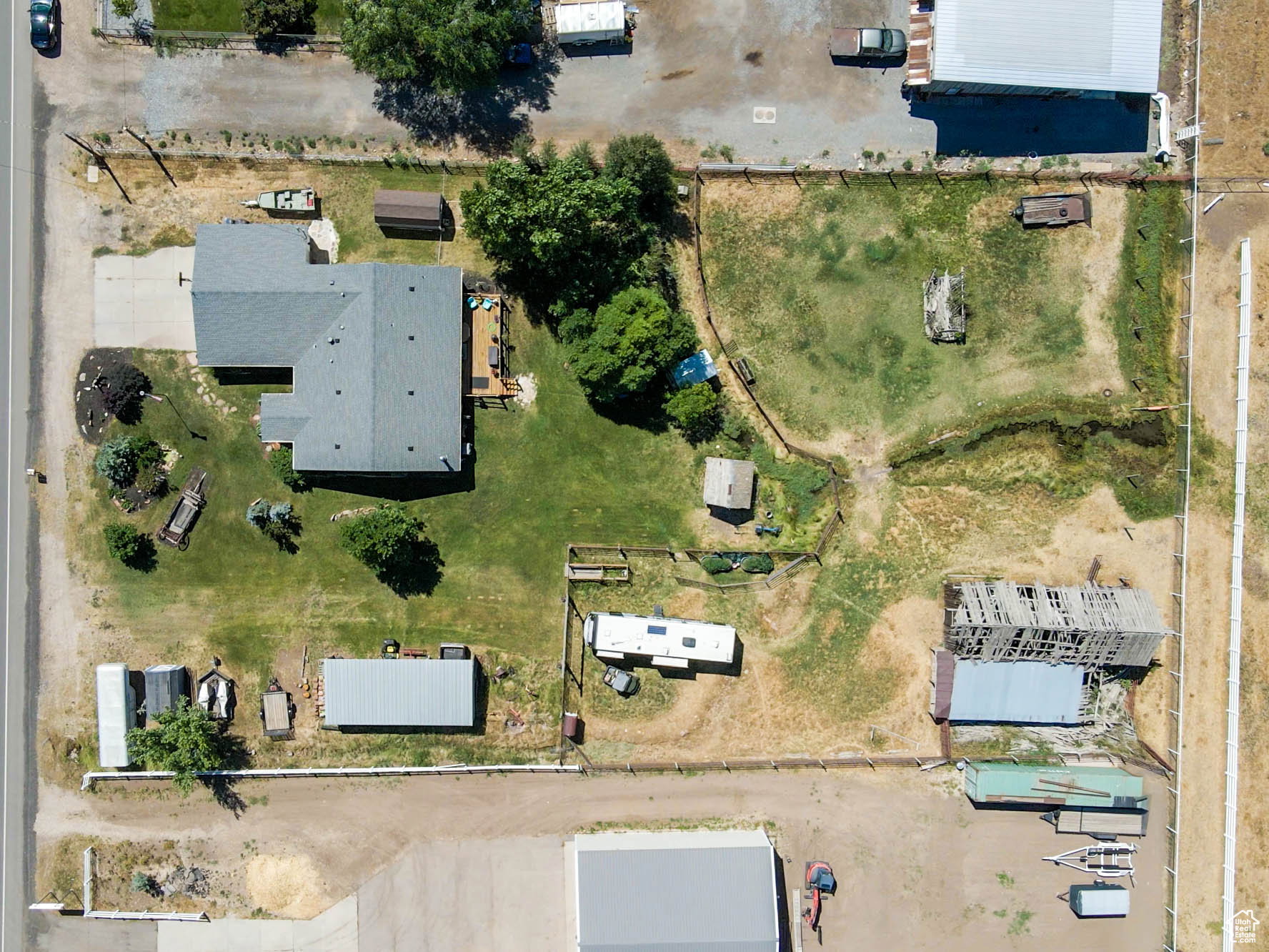 Aerial view of property, showing the year round spring that runs through.