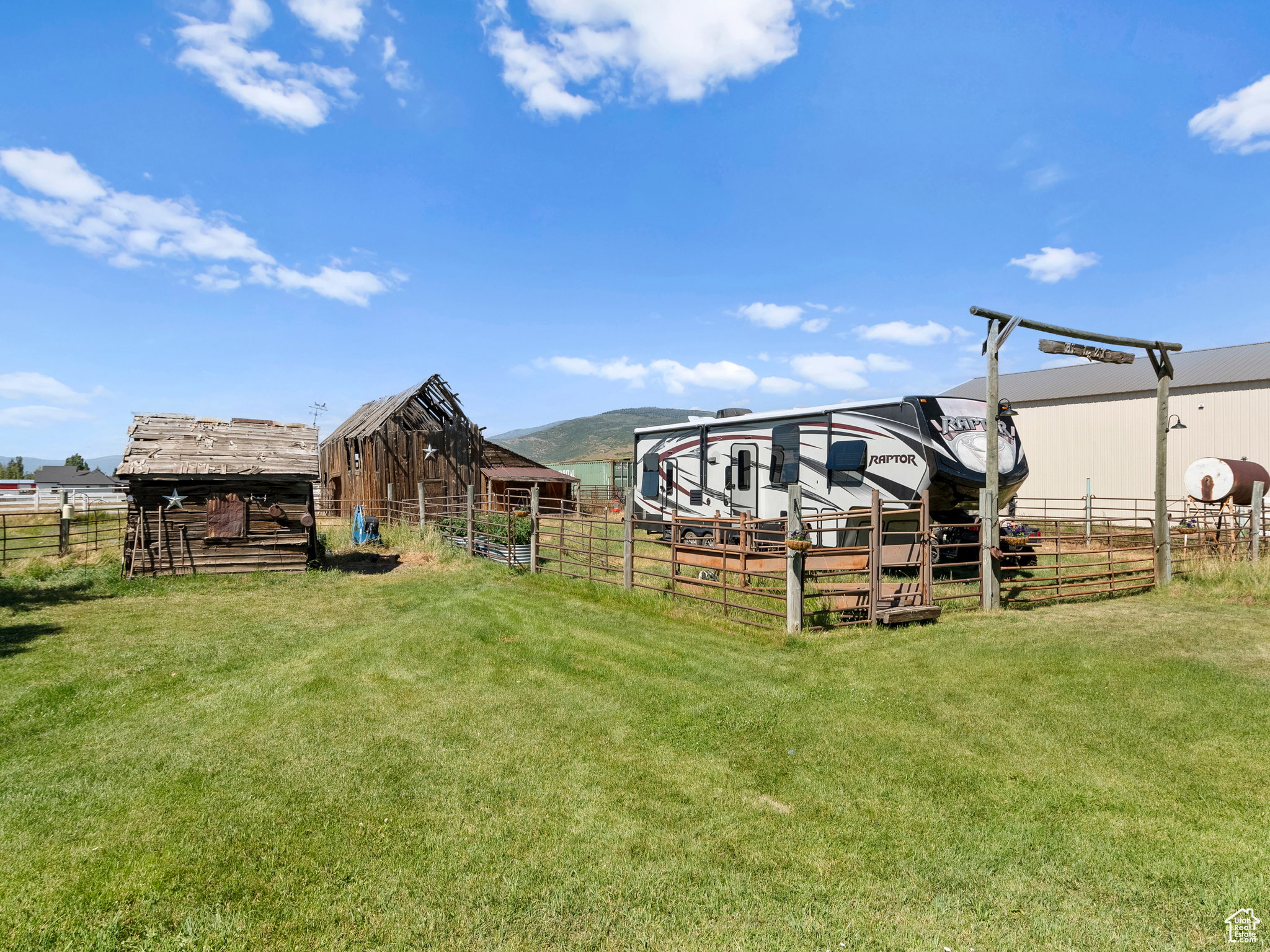 Open area with rustic wood barn.