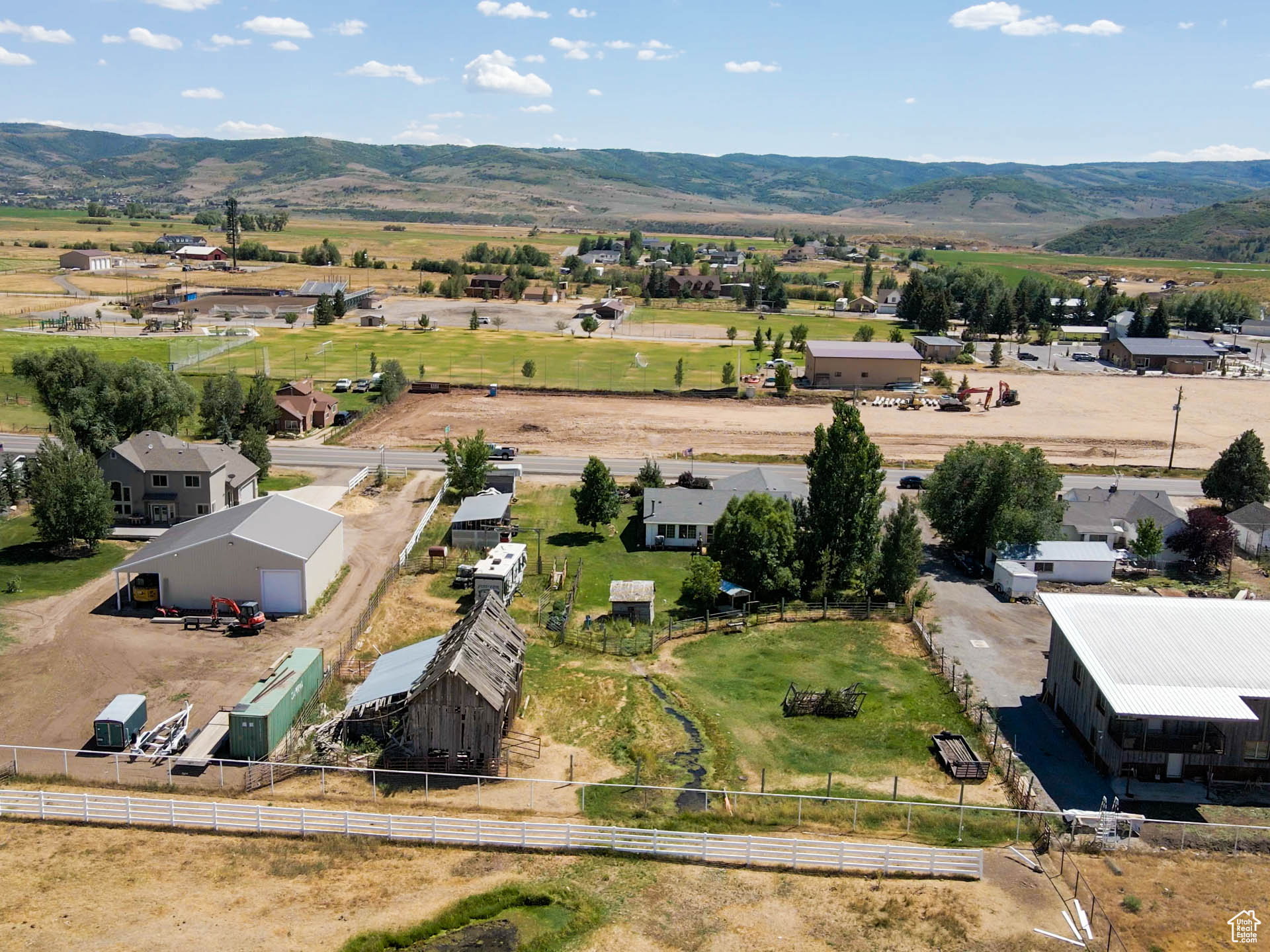 Aerial view of property, showing the year round spring that runs through.