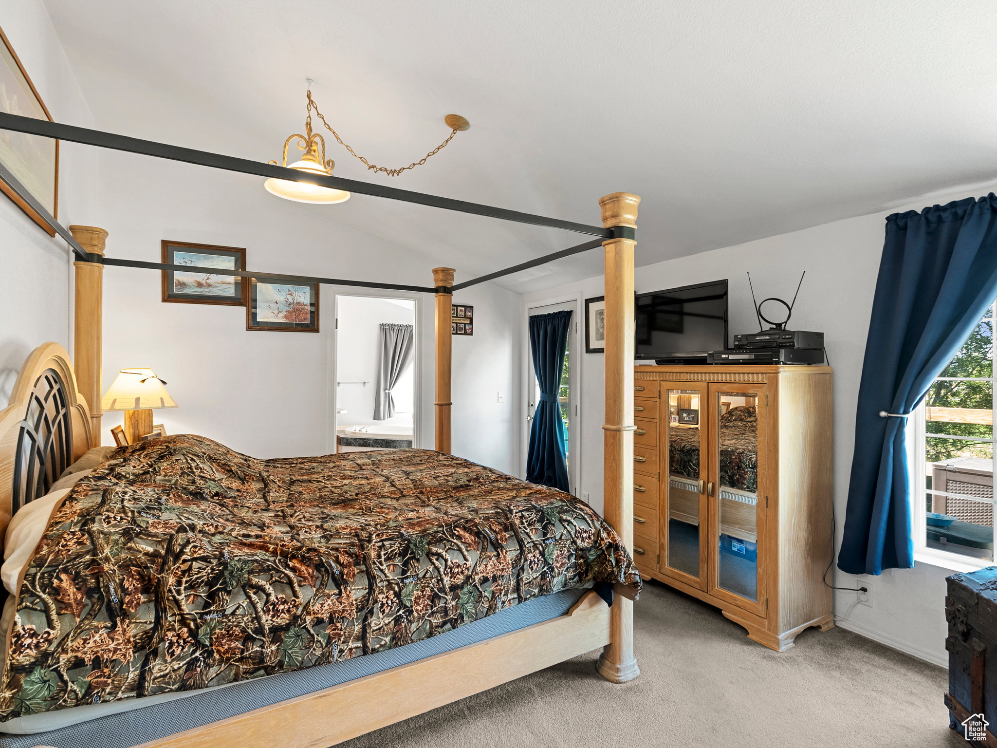 Primary bedroom with vaulted ceilings, walk in closet and on suite bathroom.