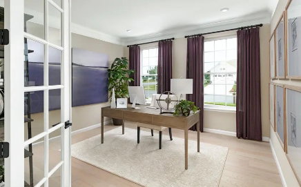 Picture of a similar model only. Not actual home. Actual home will have different finishes or options than seen here French doors open not included on Main floor Study. A brightly lit room featuring two large windows, light wood-finish flooring, and crown