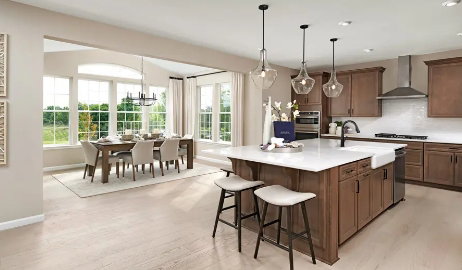 Picture of a similar model only. Not actual home. Actual home will have different finishes or options than seen here Open-concept kitchen and dining area featuring light wood-finish flooring