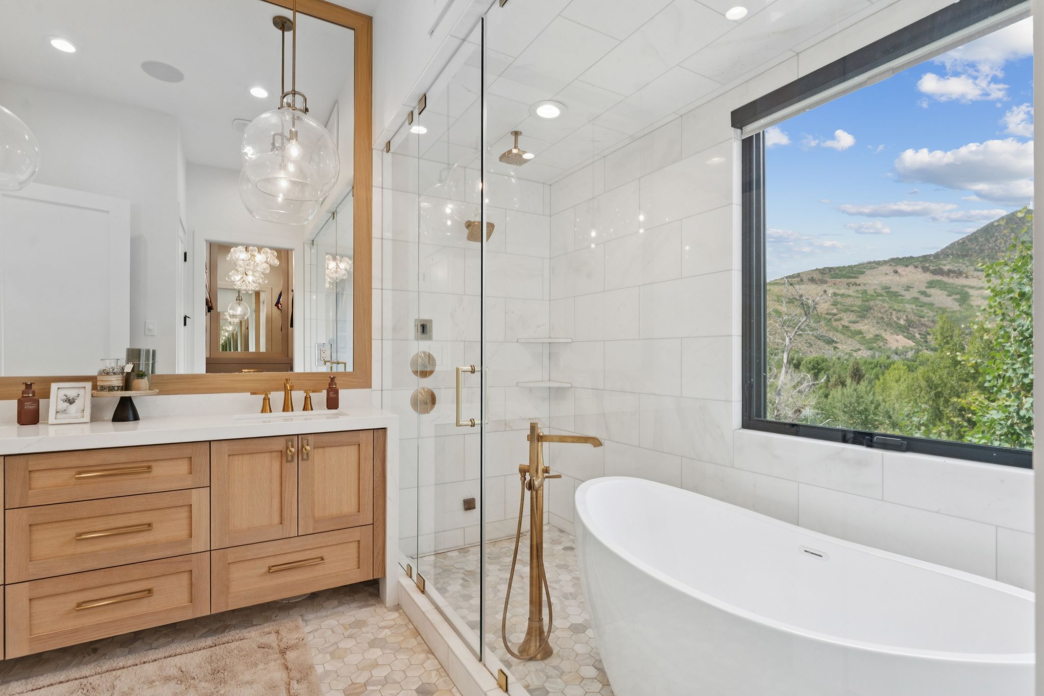 Contemporary bathroom featuring a freestanding soaking tub, a large picture window, and a glass-enclosed shower with multiple shower heads