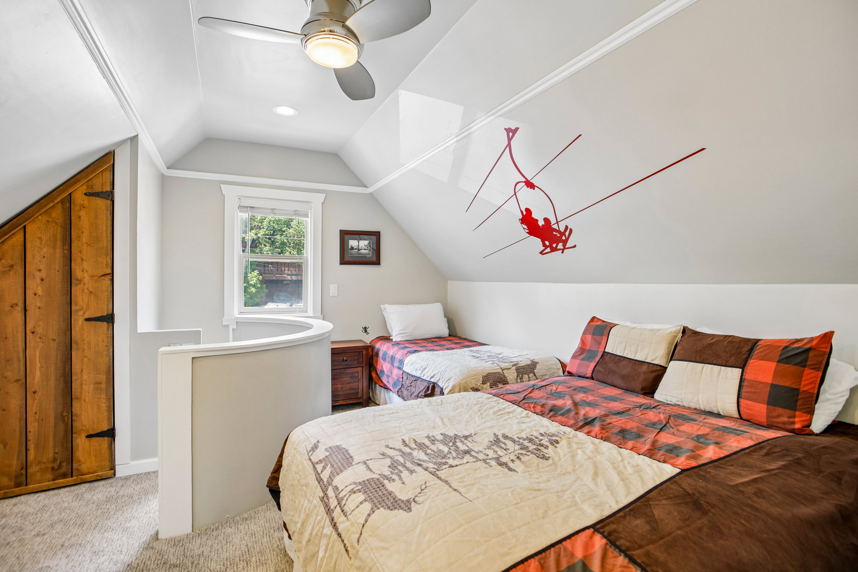 Attic room featuring sloped ceilings, recessed lighting, and a ceiling fan