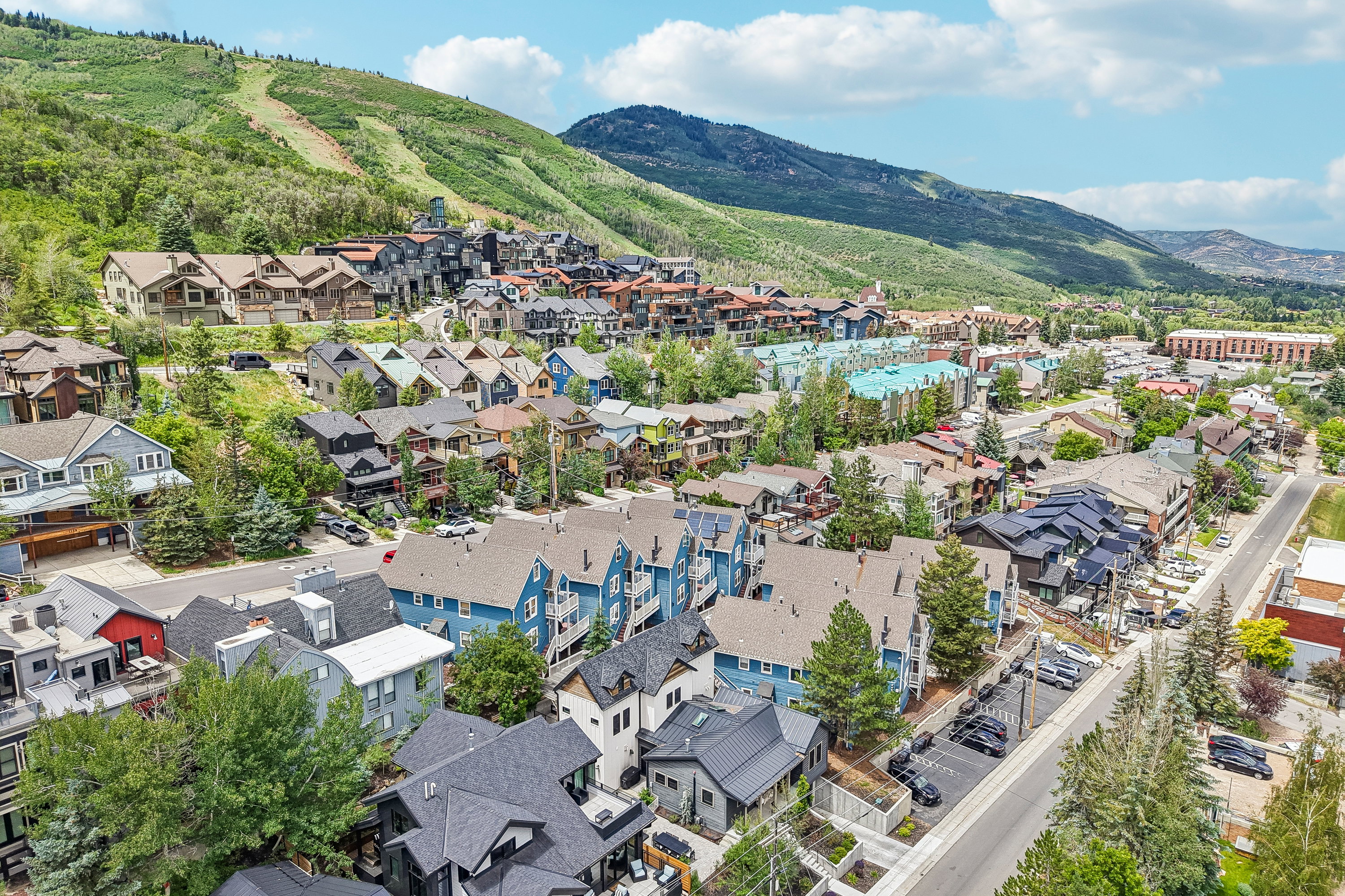 Expansive mountainside community featuring diverse architectural styles and mature landscaping