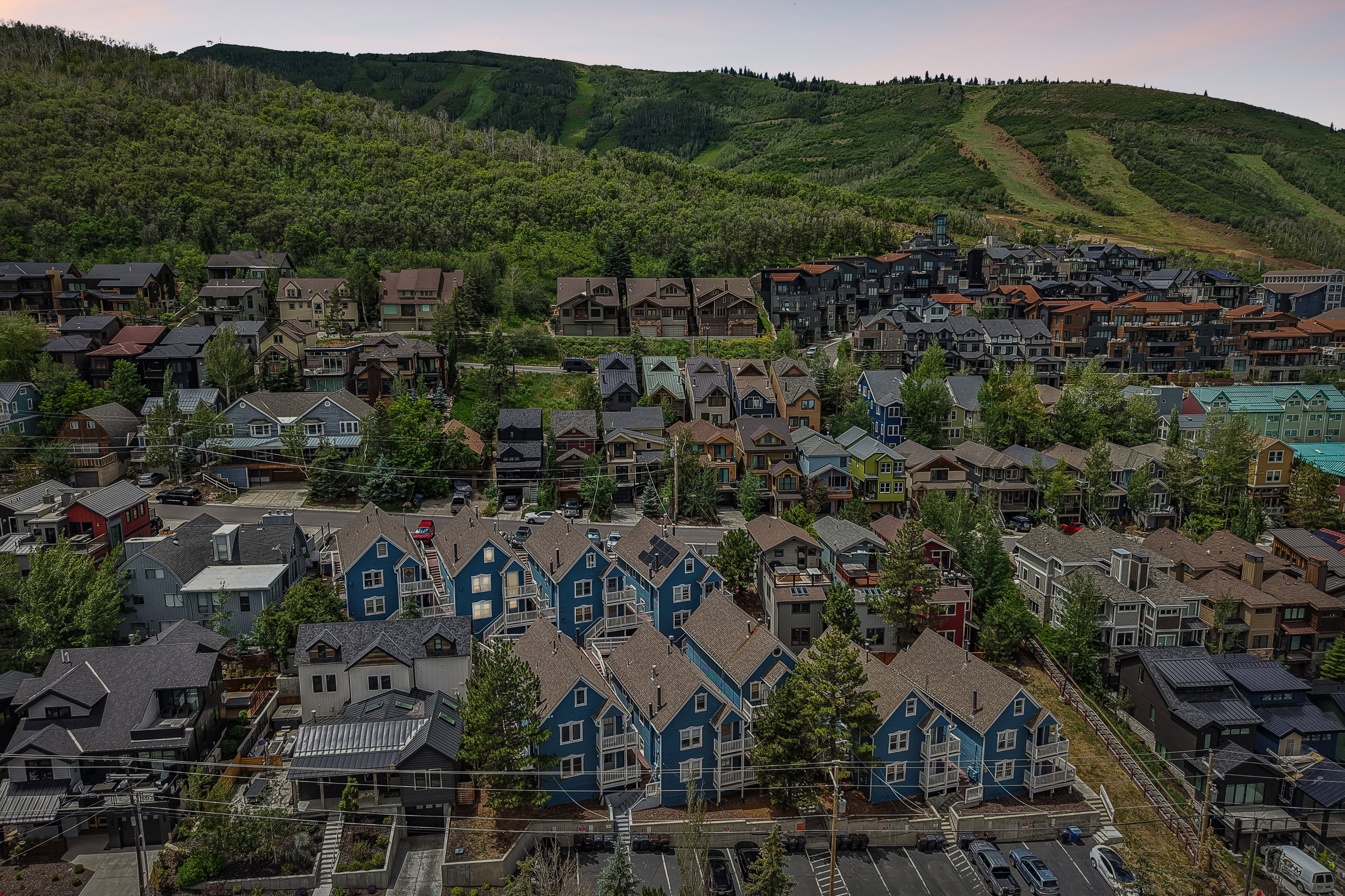 Residential community at the base of a forested mountain