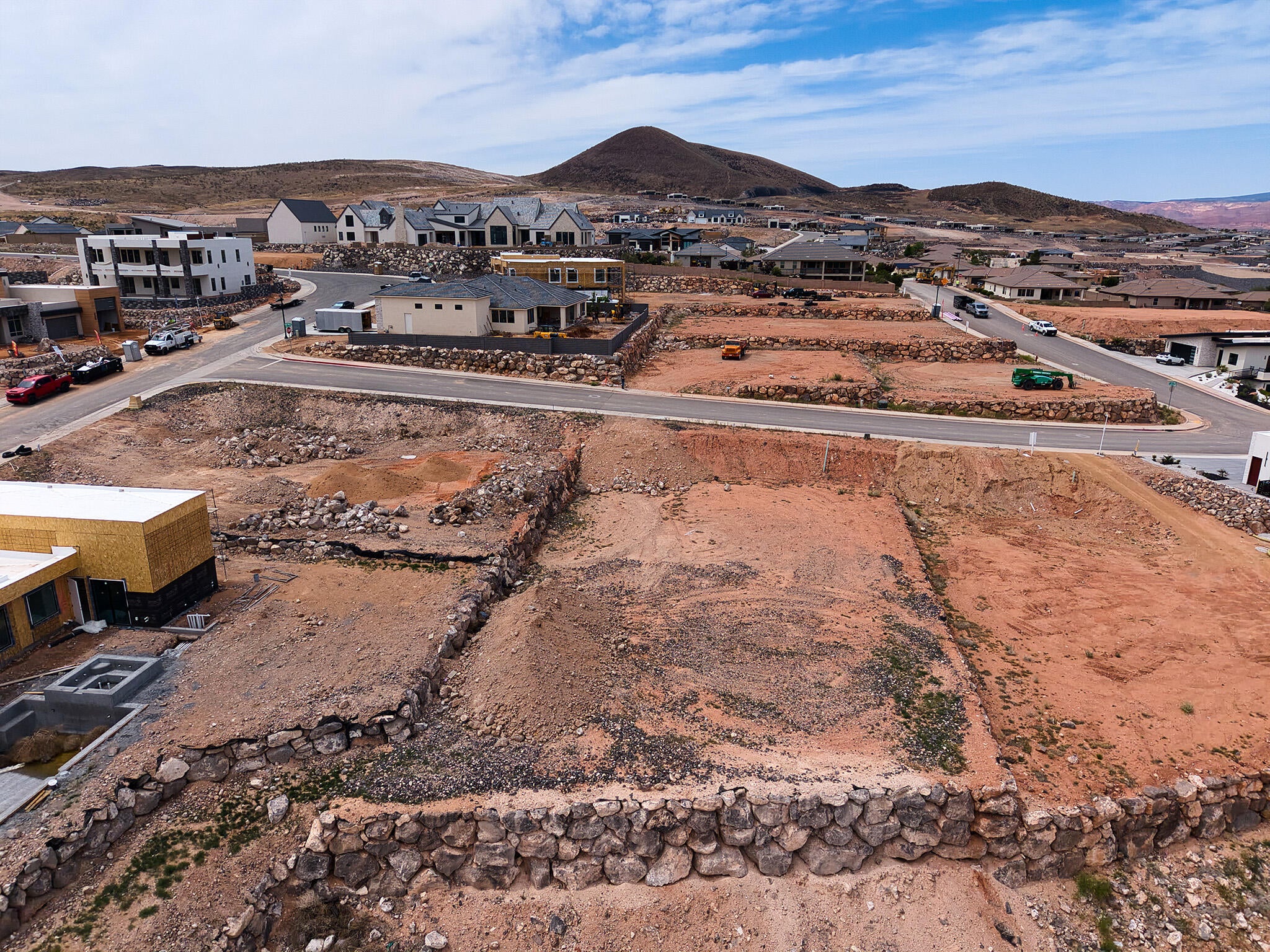 Graded building lot with existing rock retaining walls