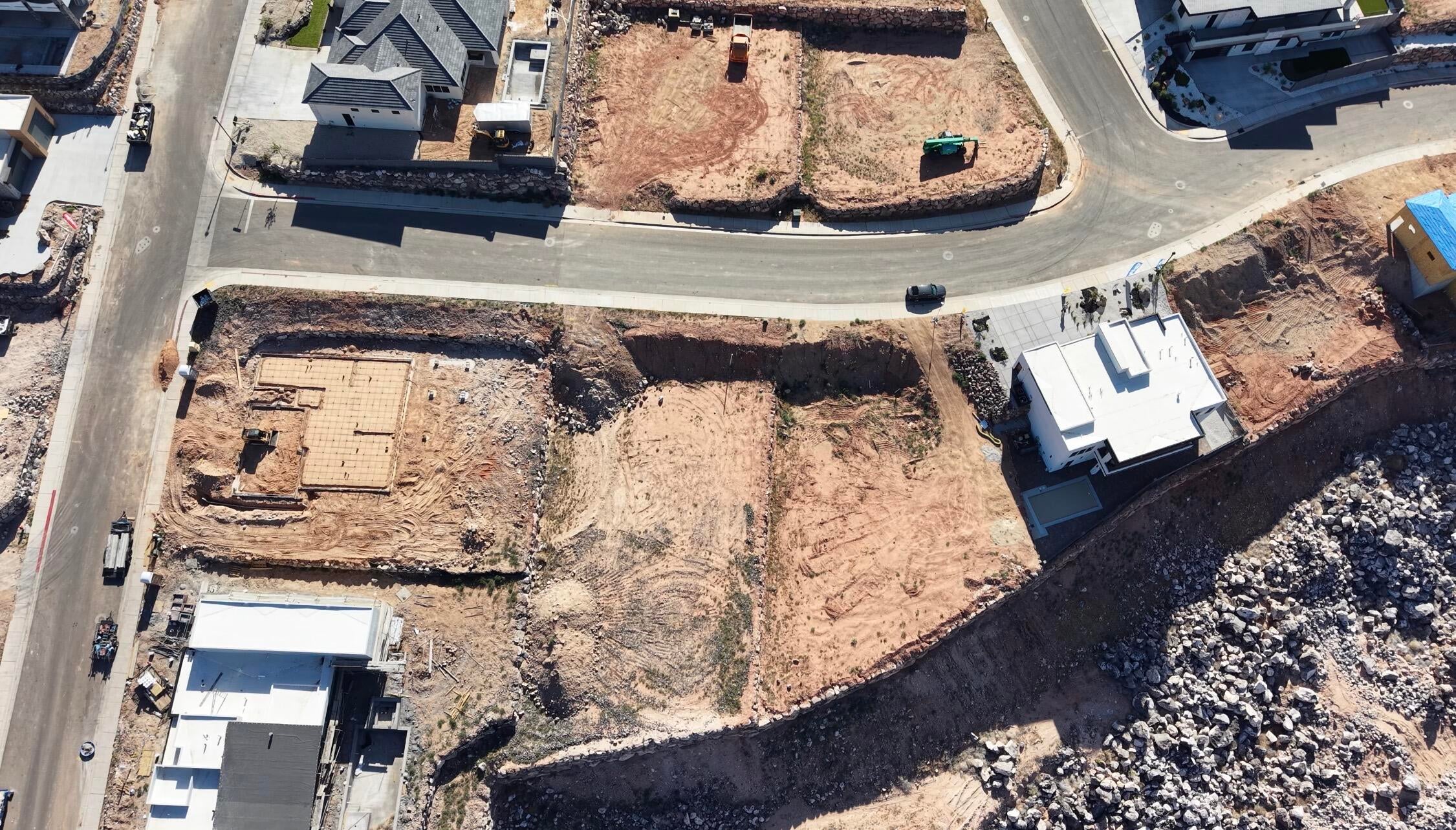 Expansive lot featuring a prepared foundation pad and graded terrain