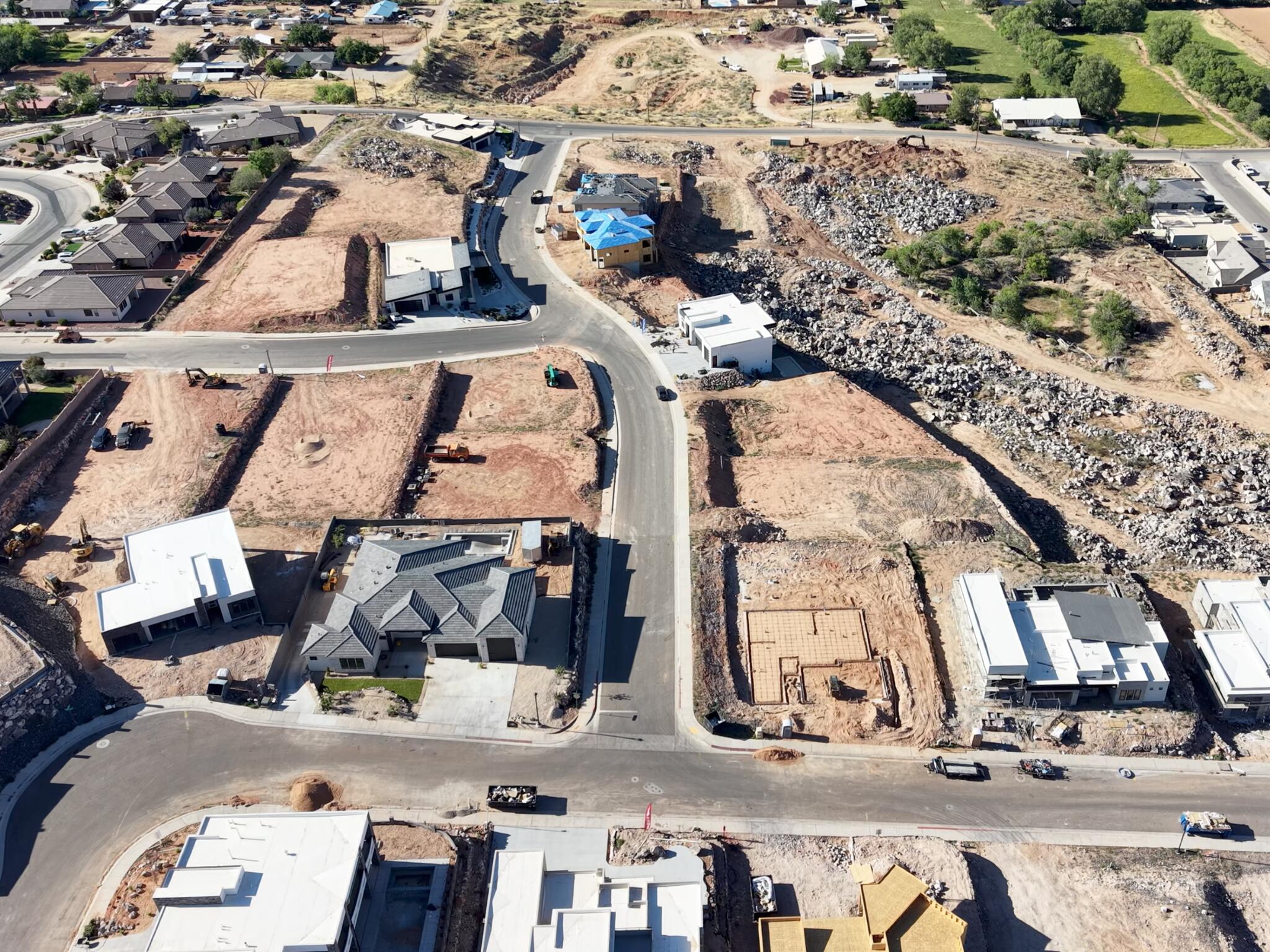 Residential development featuring multiple building sites and homes under construction