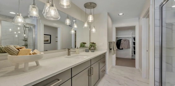 Bathroom featuring a dual vanity with a light-colored countertop and modern .cabinetry. PICTURE IS OF A SIMILAR