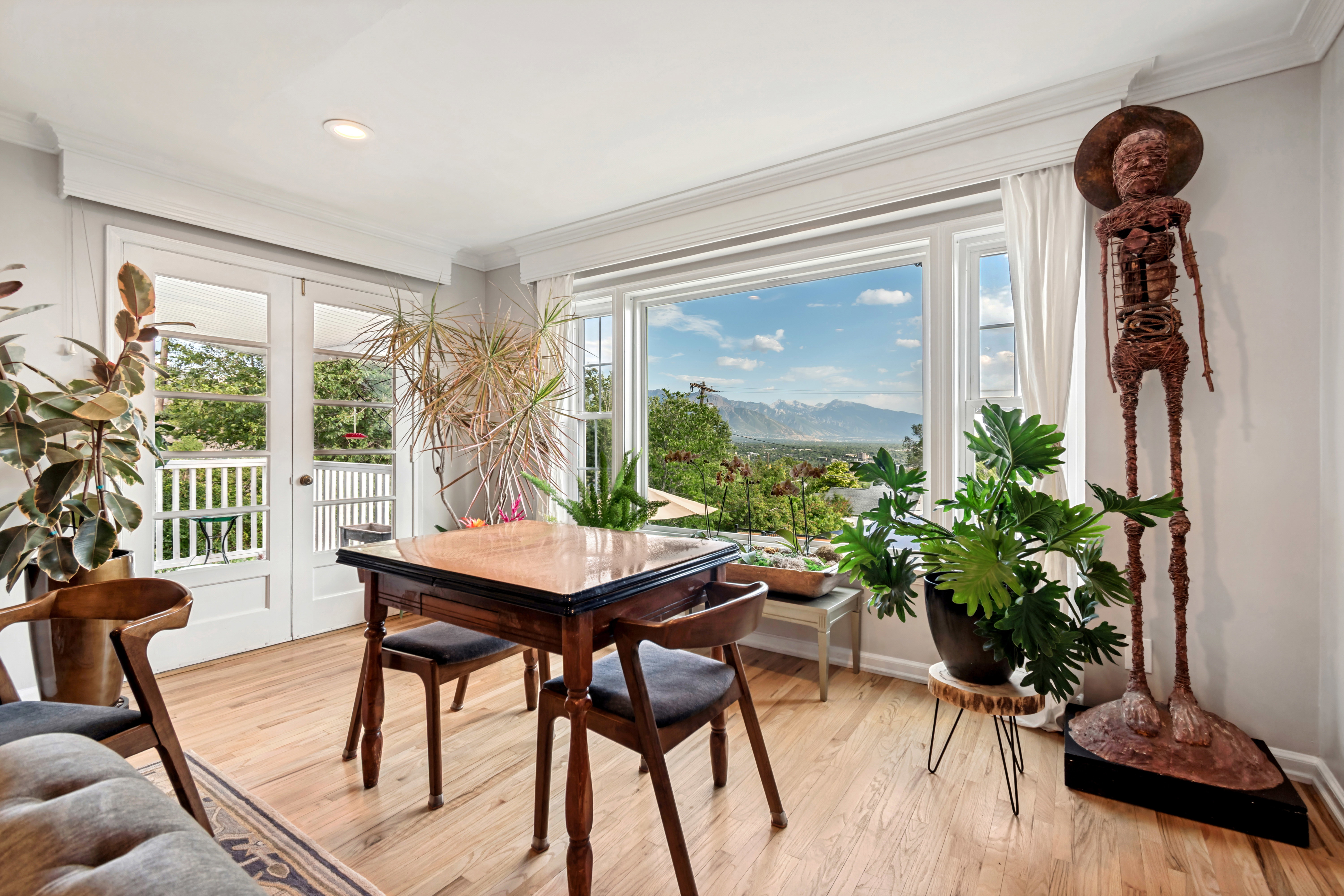 Bright interior space featuring wood-finish flooring and a prominent bay window