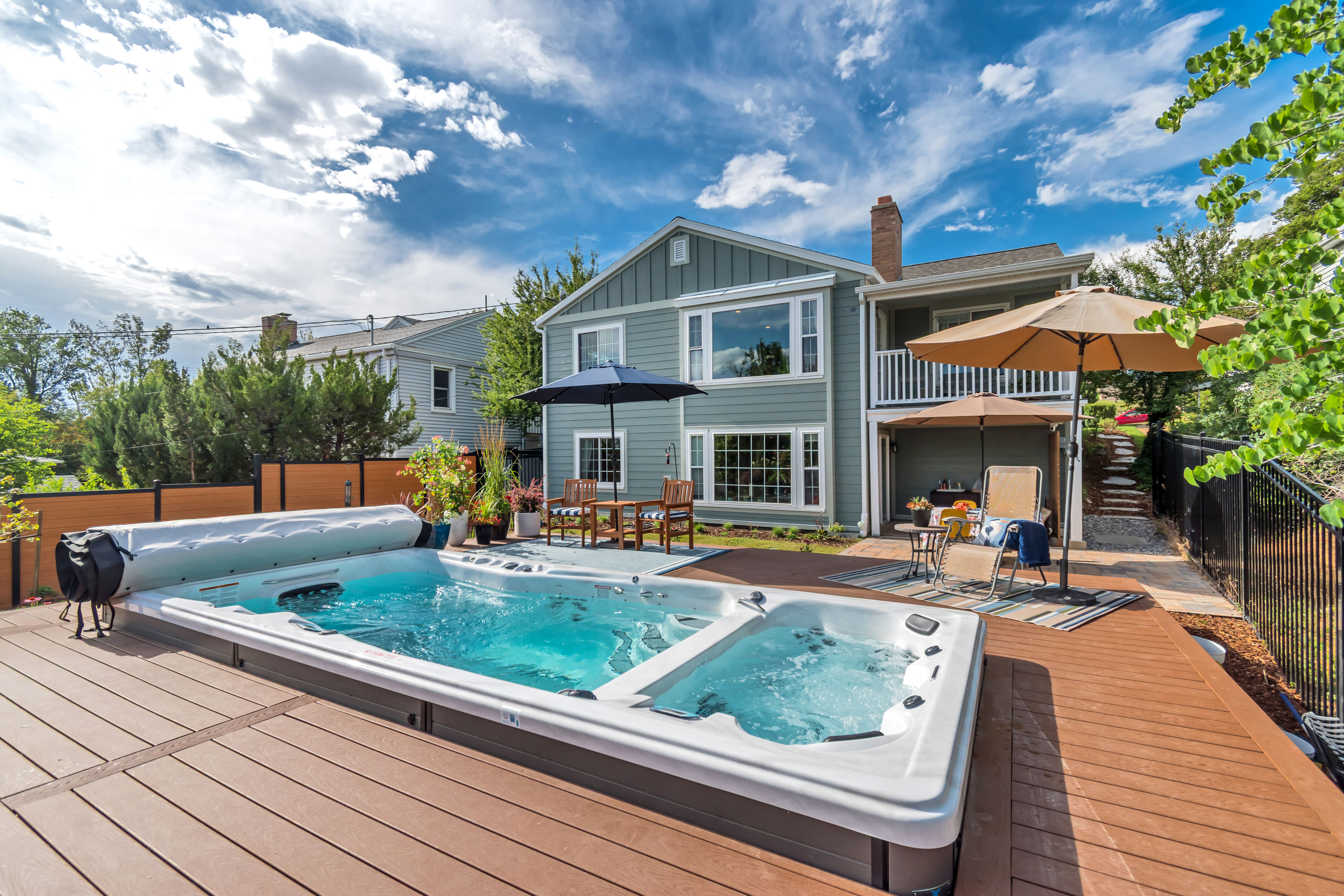 Expansive outdoor decking featuring a built-in swim spa