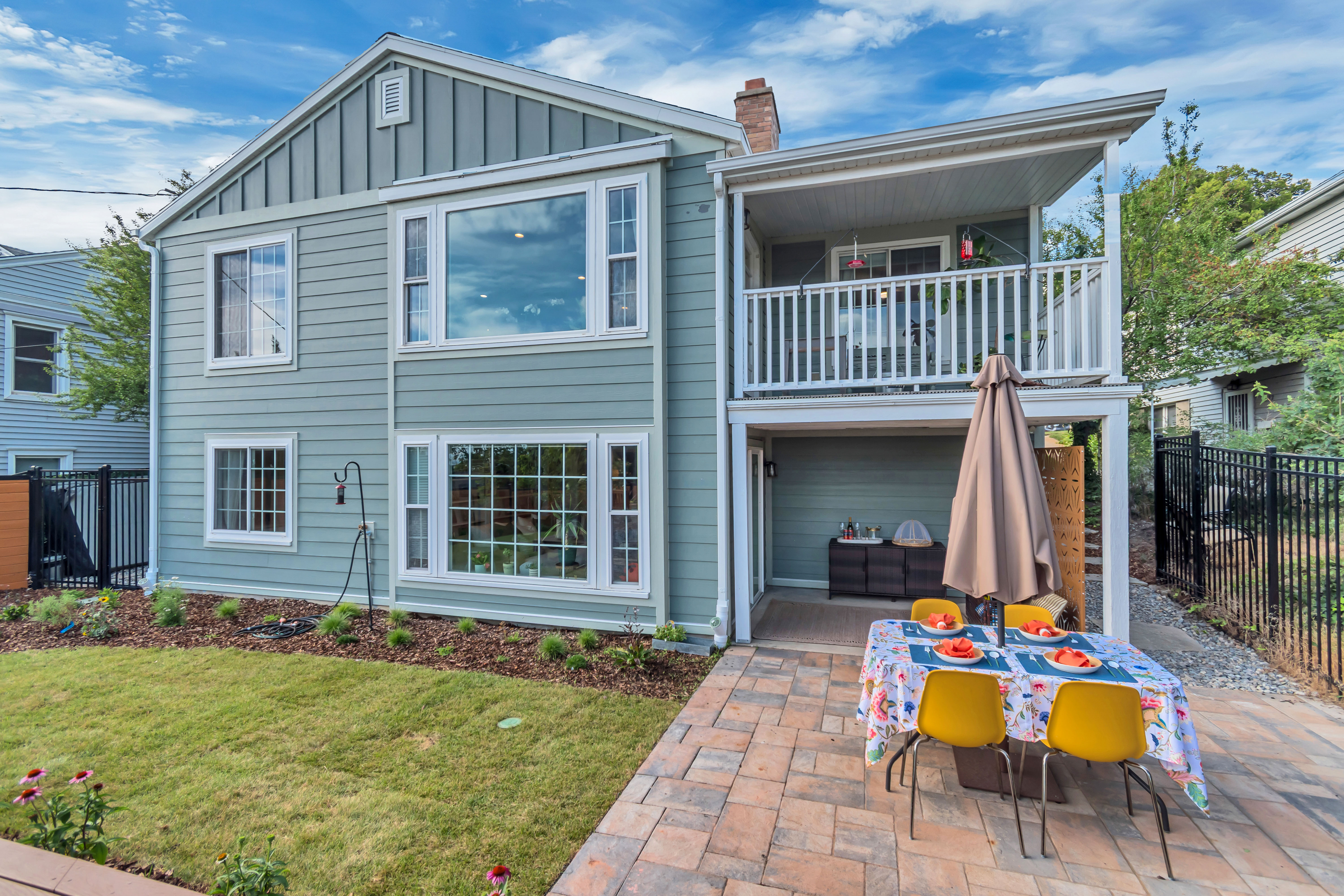 Two-story exterior with horizontal siding and vertical accent panels