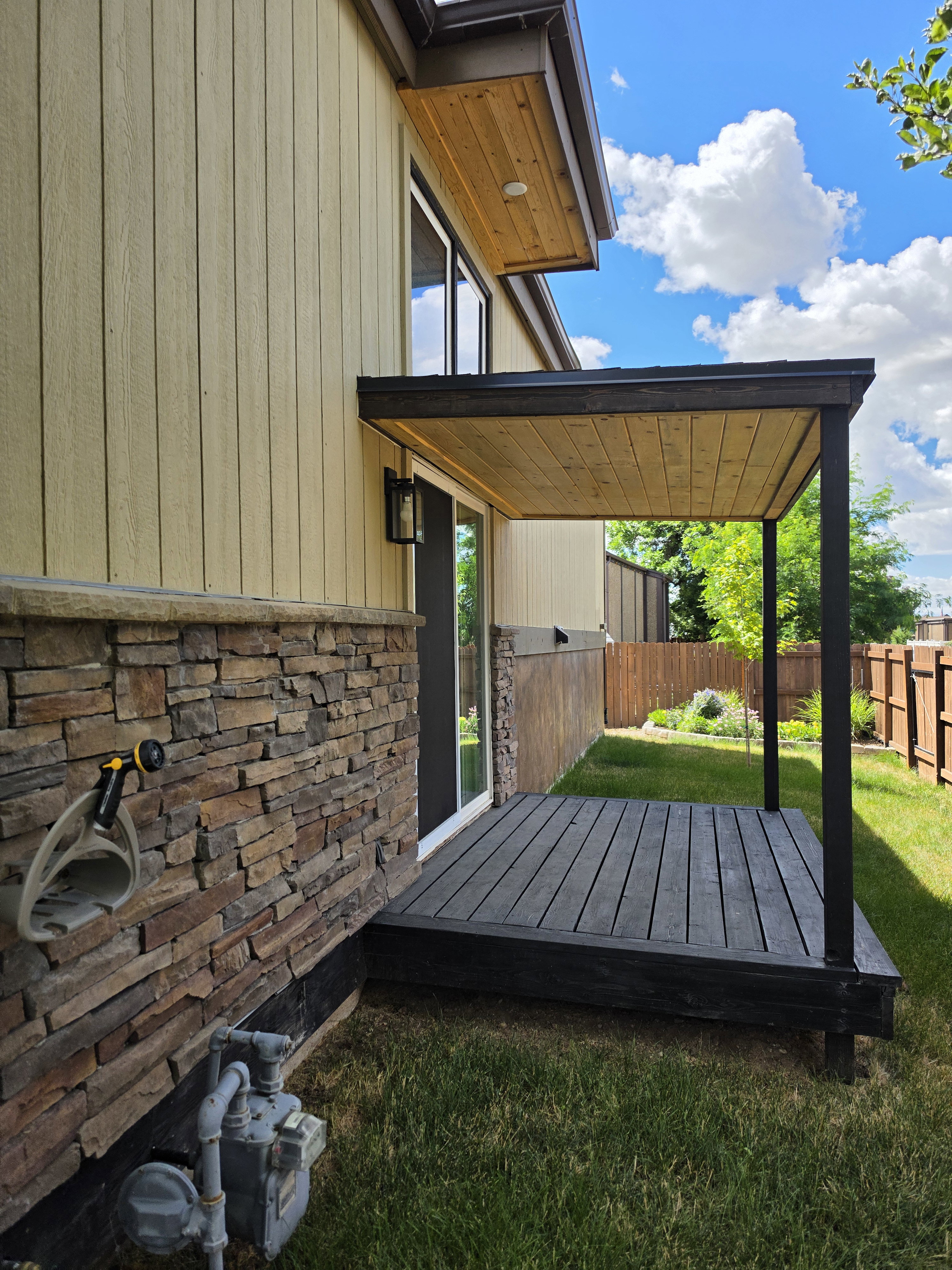 Covered patio with dark wood-finish decking