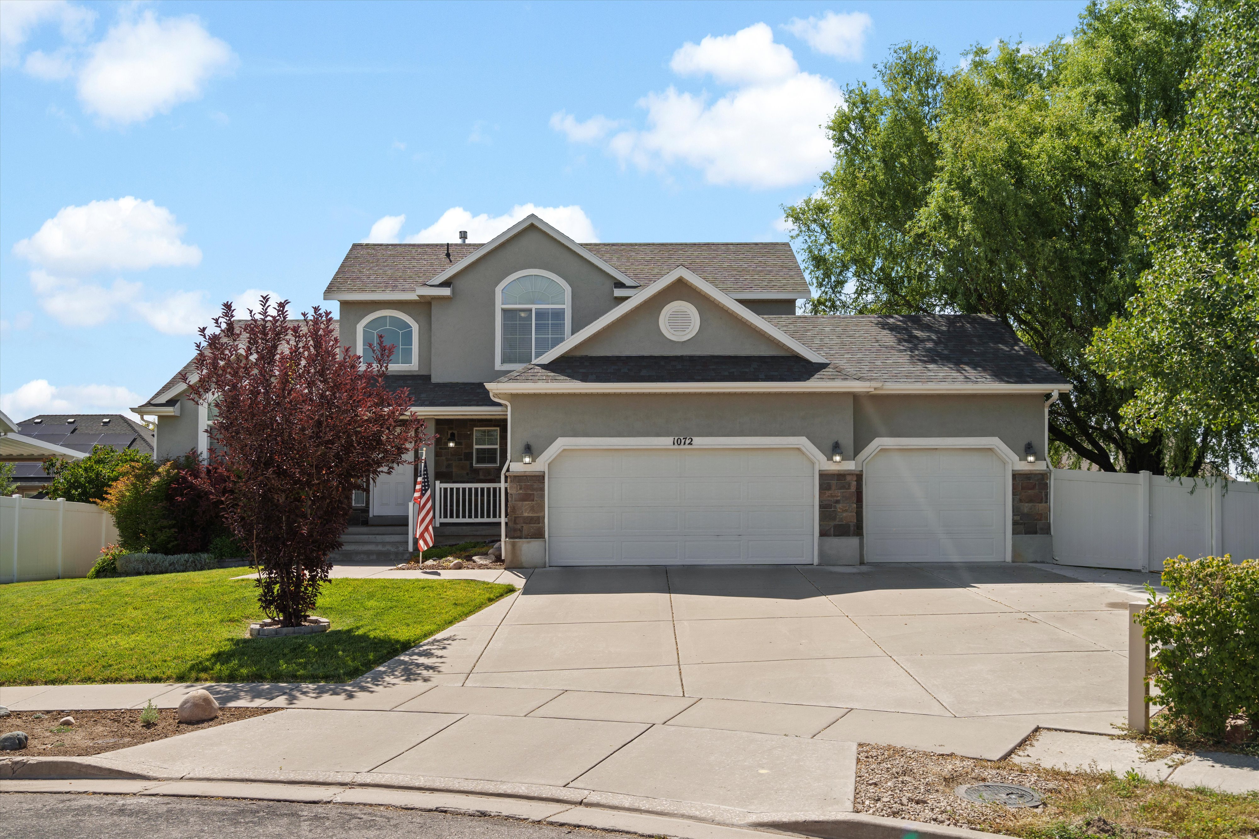 Two-story stucco residence with a three-car garage